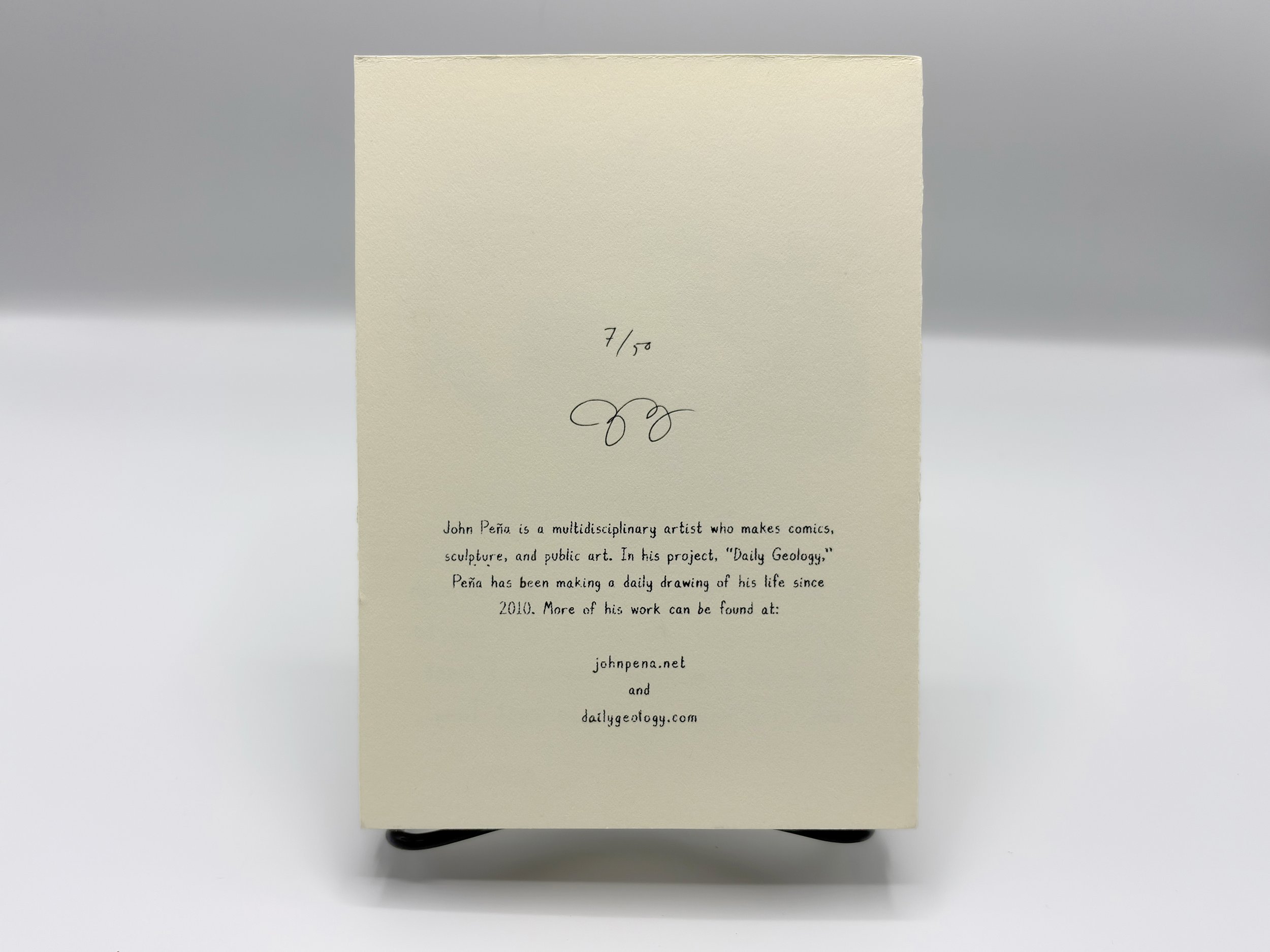 Back of book with edition number out of 50 and the artist John Pena's signature. Text describing John Pena's project Daily Geology.