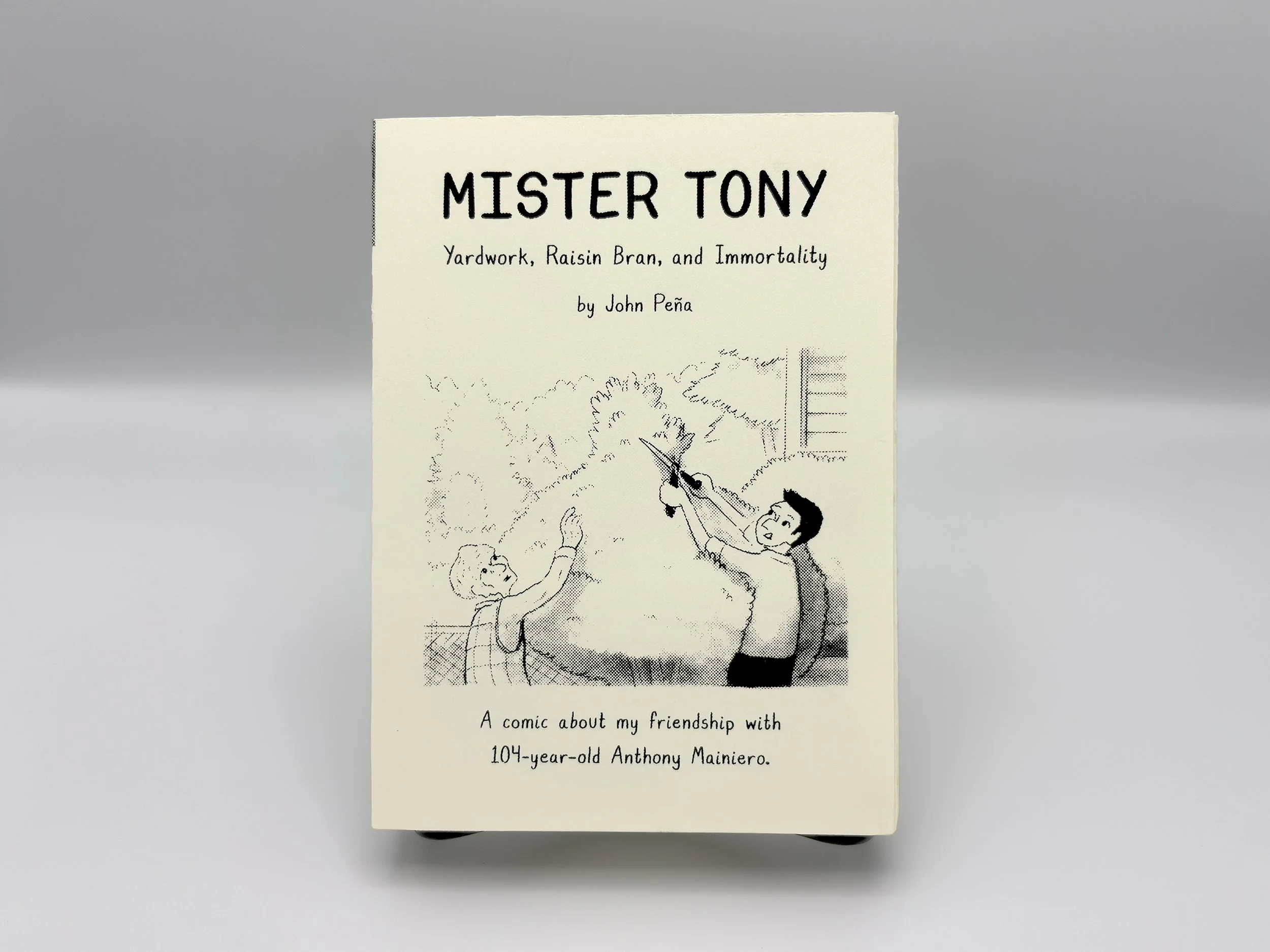 Book made with 90 pound Stonehenge paper with screenprinted text containing two individuals pruning a tree.