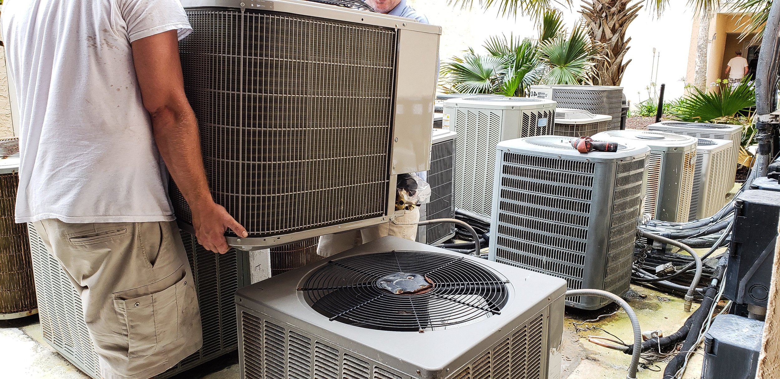 people-from-behind-lifting-heating-and-cooling-uni-2022-08-01-03-59-29-utc.jpg