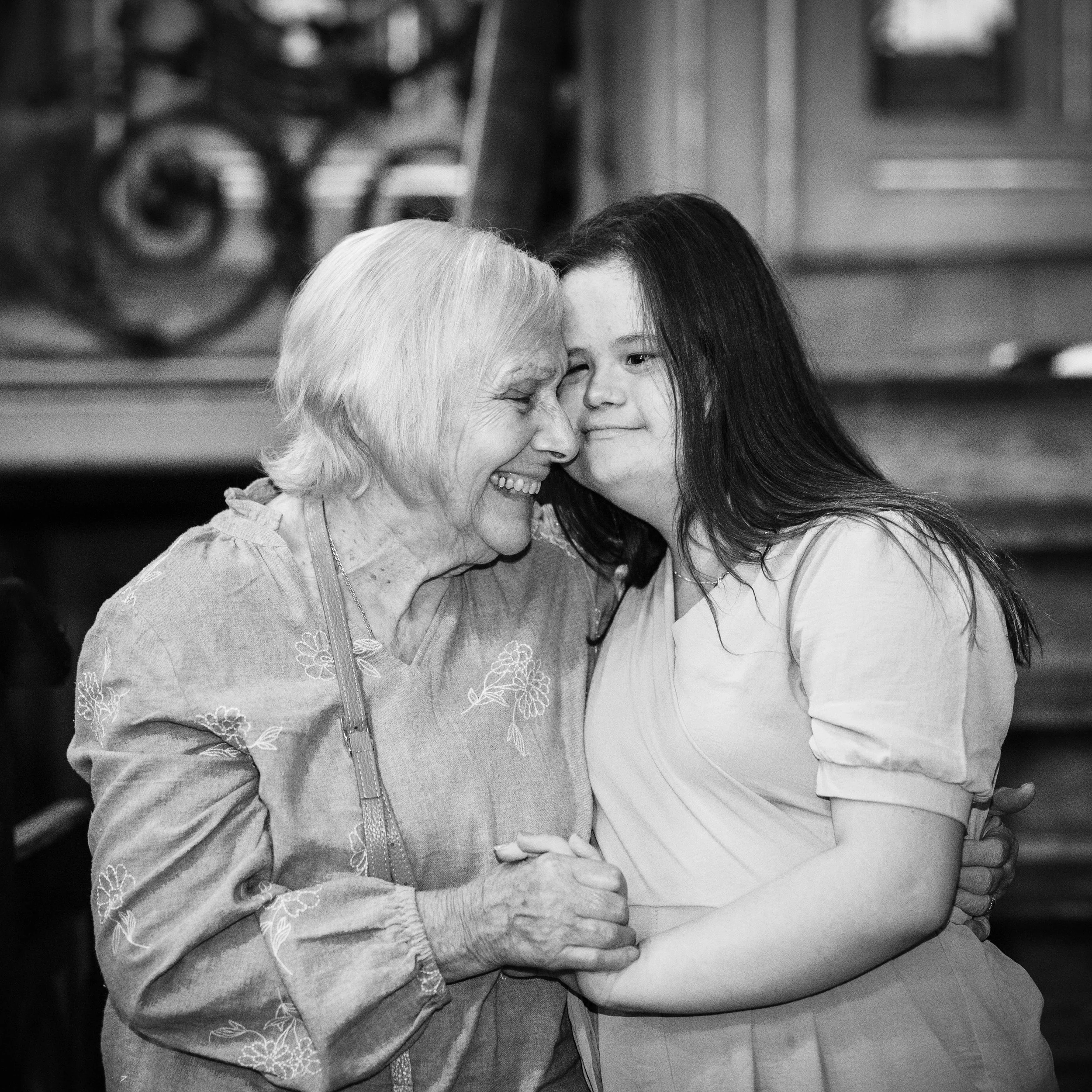 A grandmother and granddaughter at a Downs Syndrome Photographer Awards Event