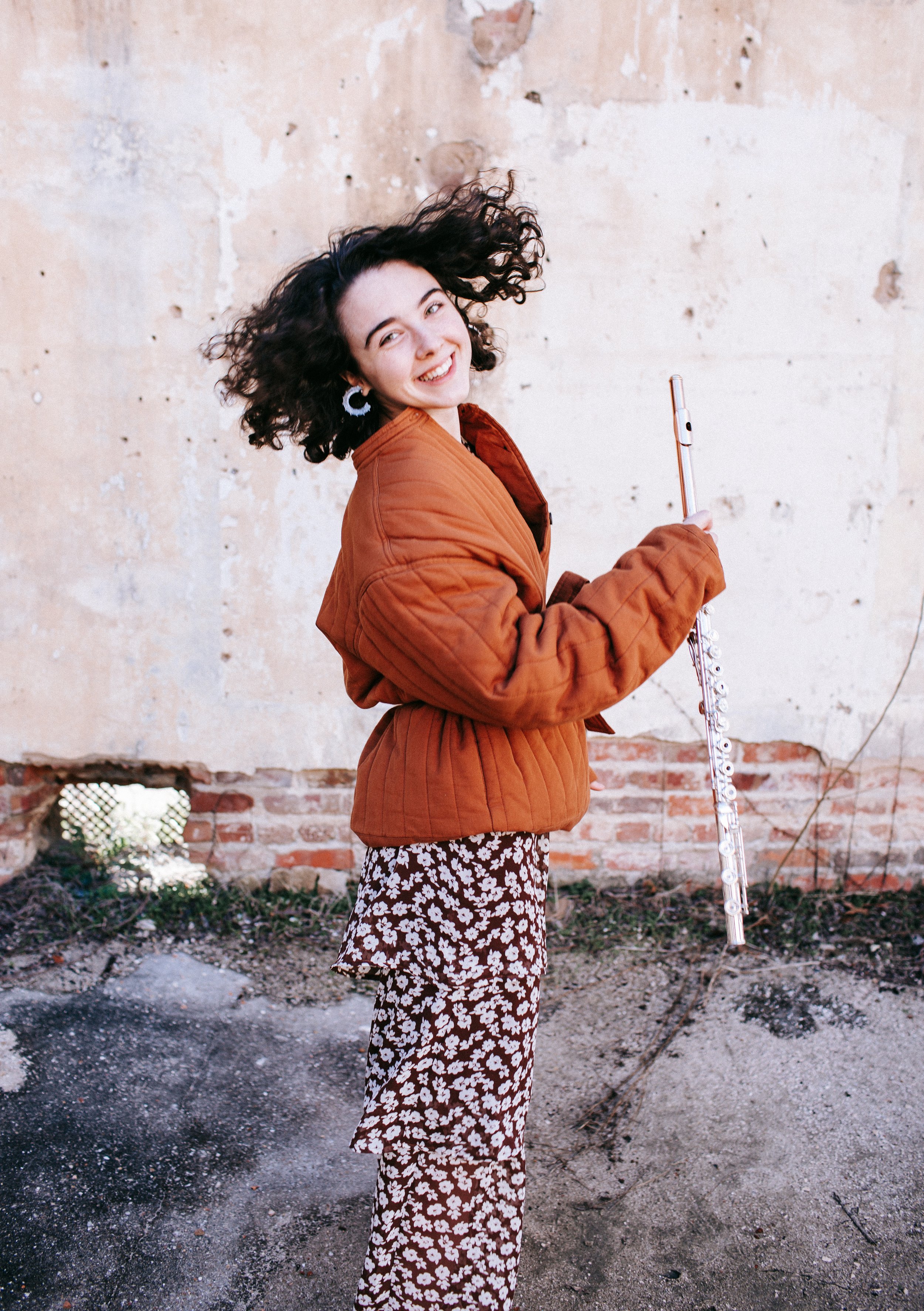 Lexi Eubanks, a flutist hailing from Bremen, Georgia, is pursuing a Master's degree at the University of Michigan in flute performance and chamber music. She earned her Bachelor's degree in flute performance at the Schwob School of Music in Georgia i