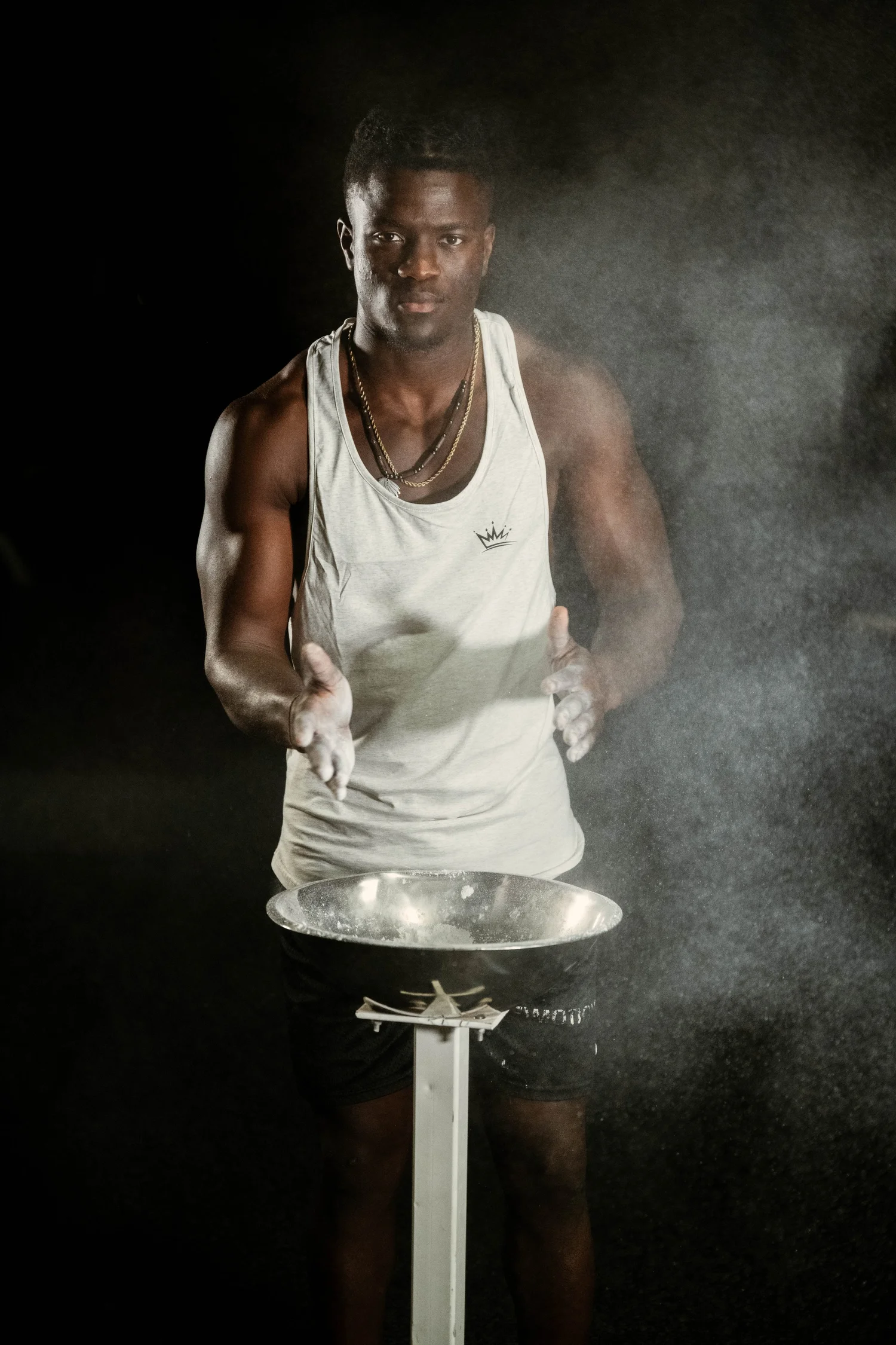 Athlete lifting under dramatic light