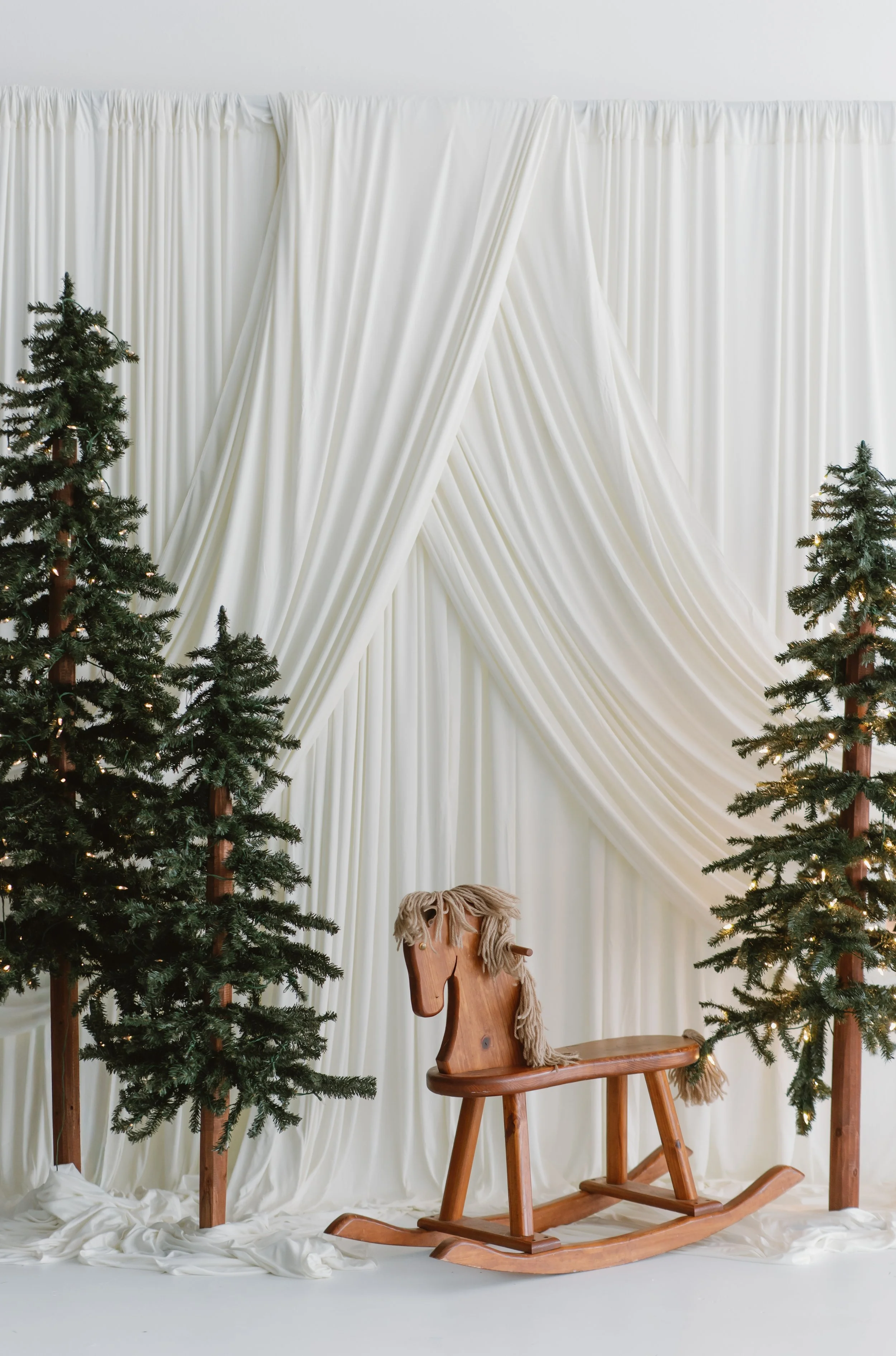Christmas Pictures with a rocking horse and Christmas trees