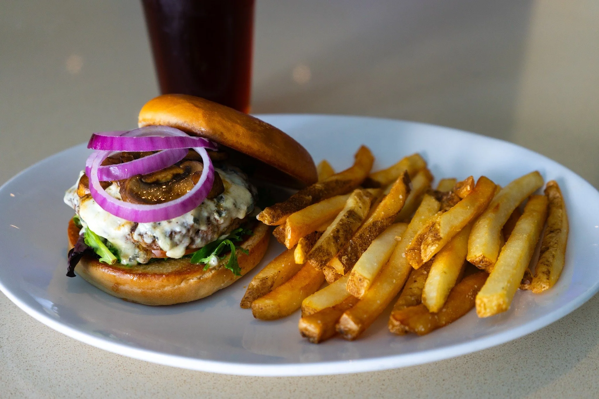 Black &amp; Blue Burger
Looking for a burger that&rsquo;s as bold as it is delicious? Our Beach Burger Spotlight takes a blackened patty and layers it with freshness, tang, and spice. The sharp bite of blue cheese, the sweetness of saut&eacute;ed oni