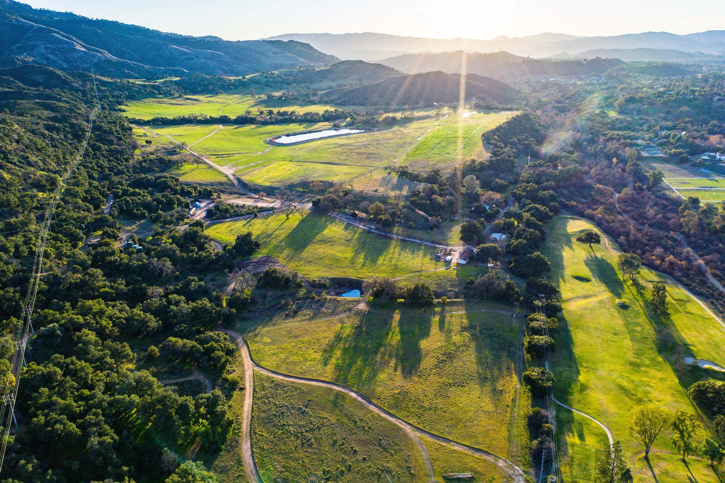 An aerial view of RMR’s green pastures and oak-covered hills