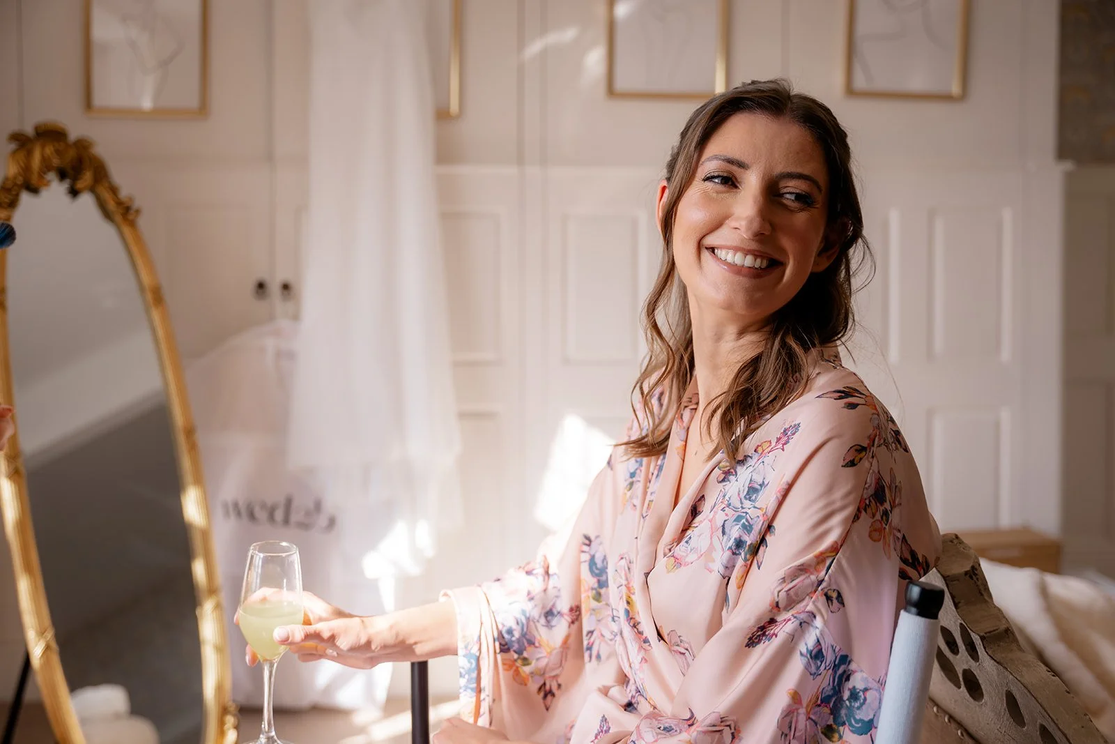 Lilly smiling during bridal preparations at Broadfield Court in Herefordshire, photographed by Just James Weddings for relaxed and natural wedding morning moments.