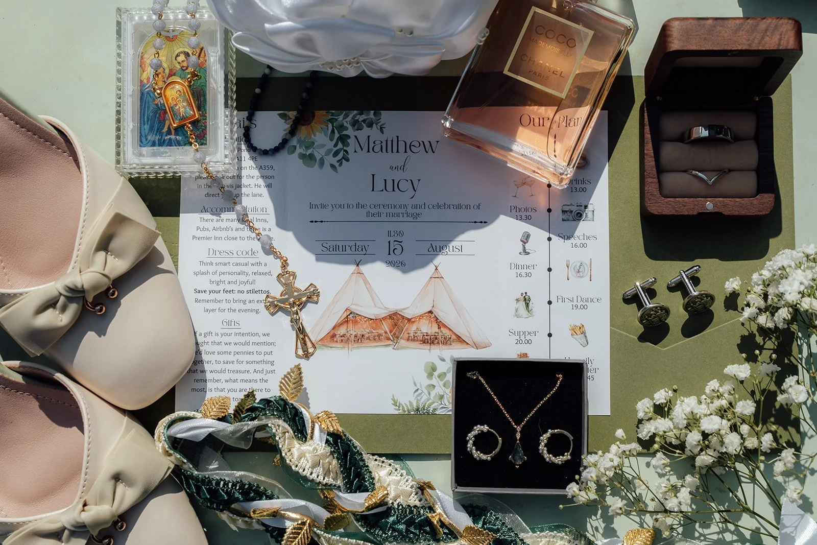 Lucy and Matthew’s wedding invitation, rings, jewellery, shoes and personal details styled together for their Curated Canvas wedding in Somerset, photographed by Just James Weddings.