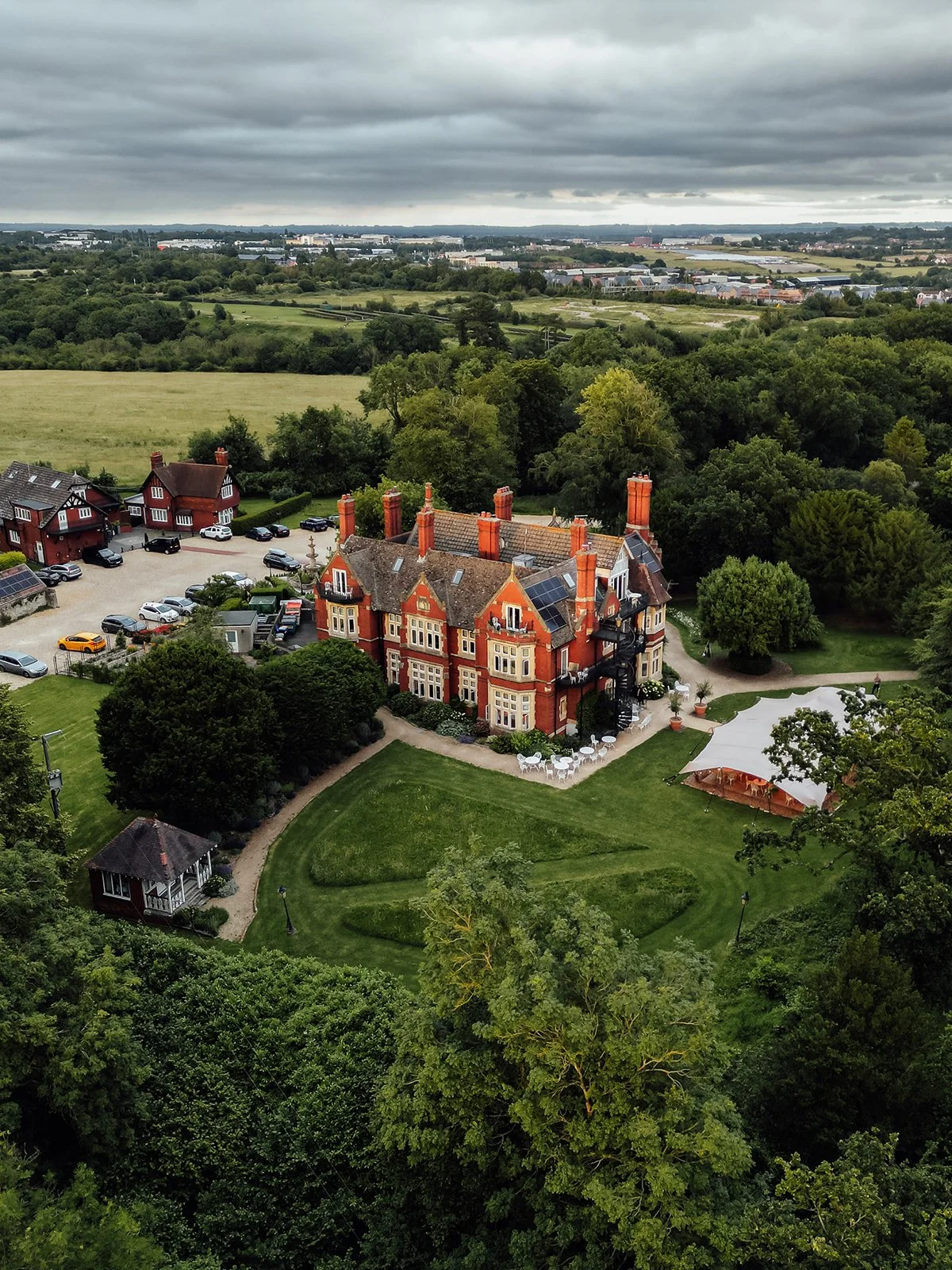 Aerial view of Berwick Lodge and its surrounding gardens during Melody & Jonny’s wedding in Bristol, photographed by Just James Weddings.