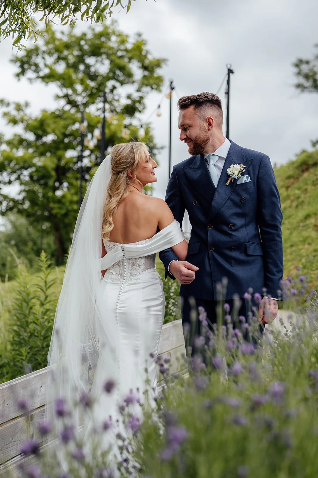Amy & Connor share a quiet moment together among the lavender and greenery in the gardens at Sandy Cove Hotel in North Devon, UK.