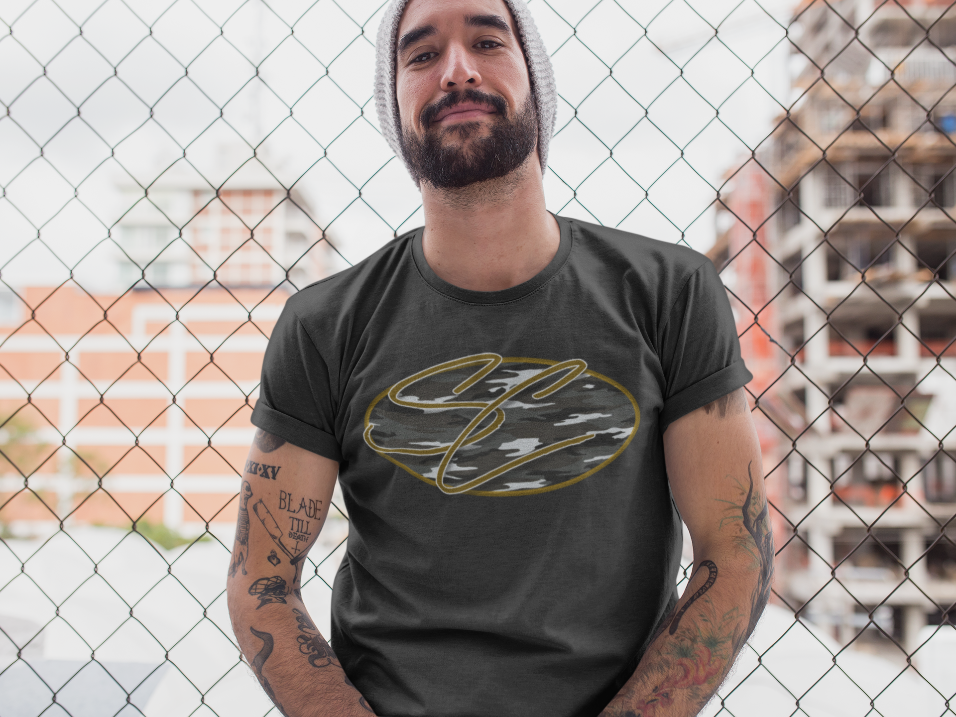 hipster-middle-aged-man-wearing-a-round-neck-tee-mockup-while-lying-against-a-fence-a17020 (1).png