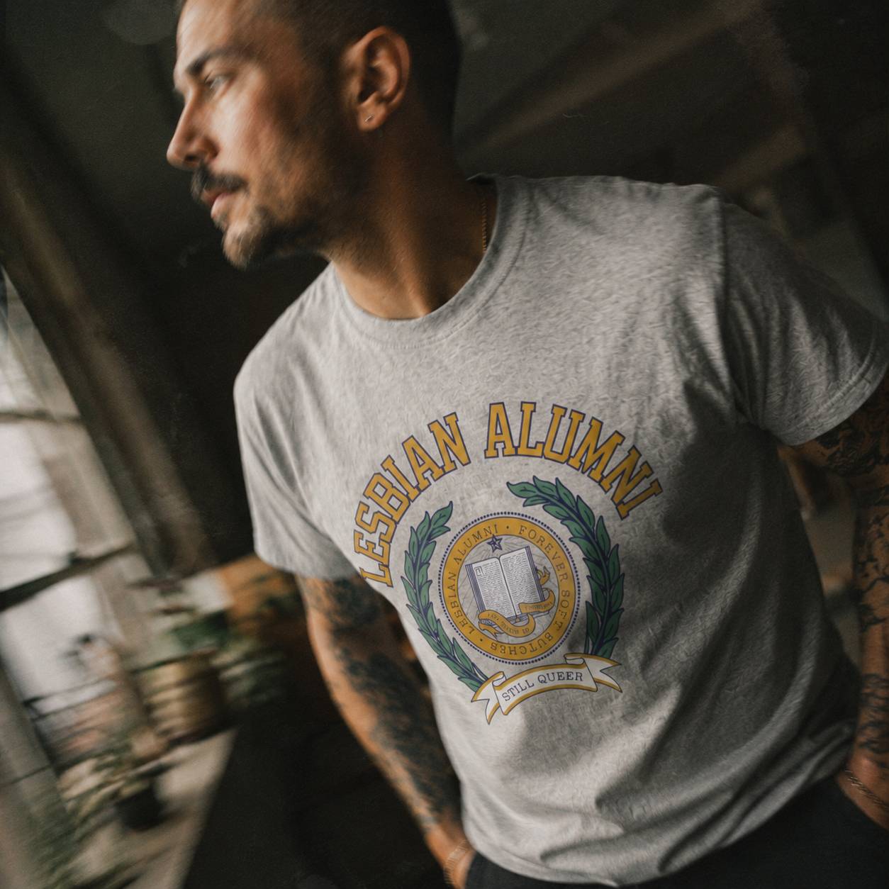 LA_LesbianAlumni_Collegiate_Tshirt_HeatherGrey_Crest_Lifestyle_2.png