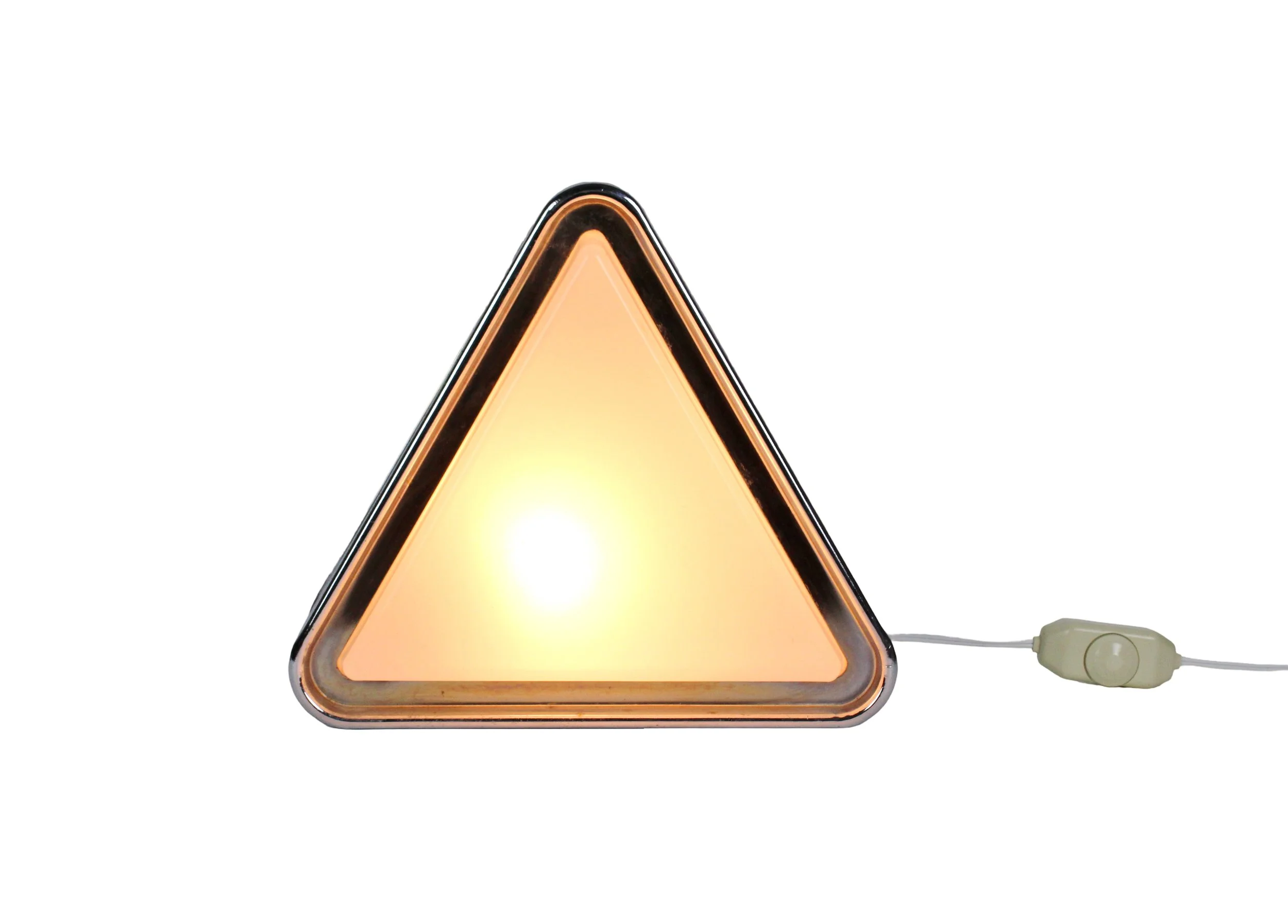 A triangular shaped lamp with a chrome metal frame outside and softly illuminated white glass inset
