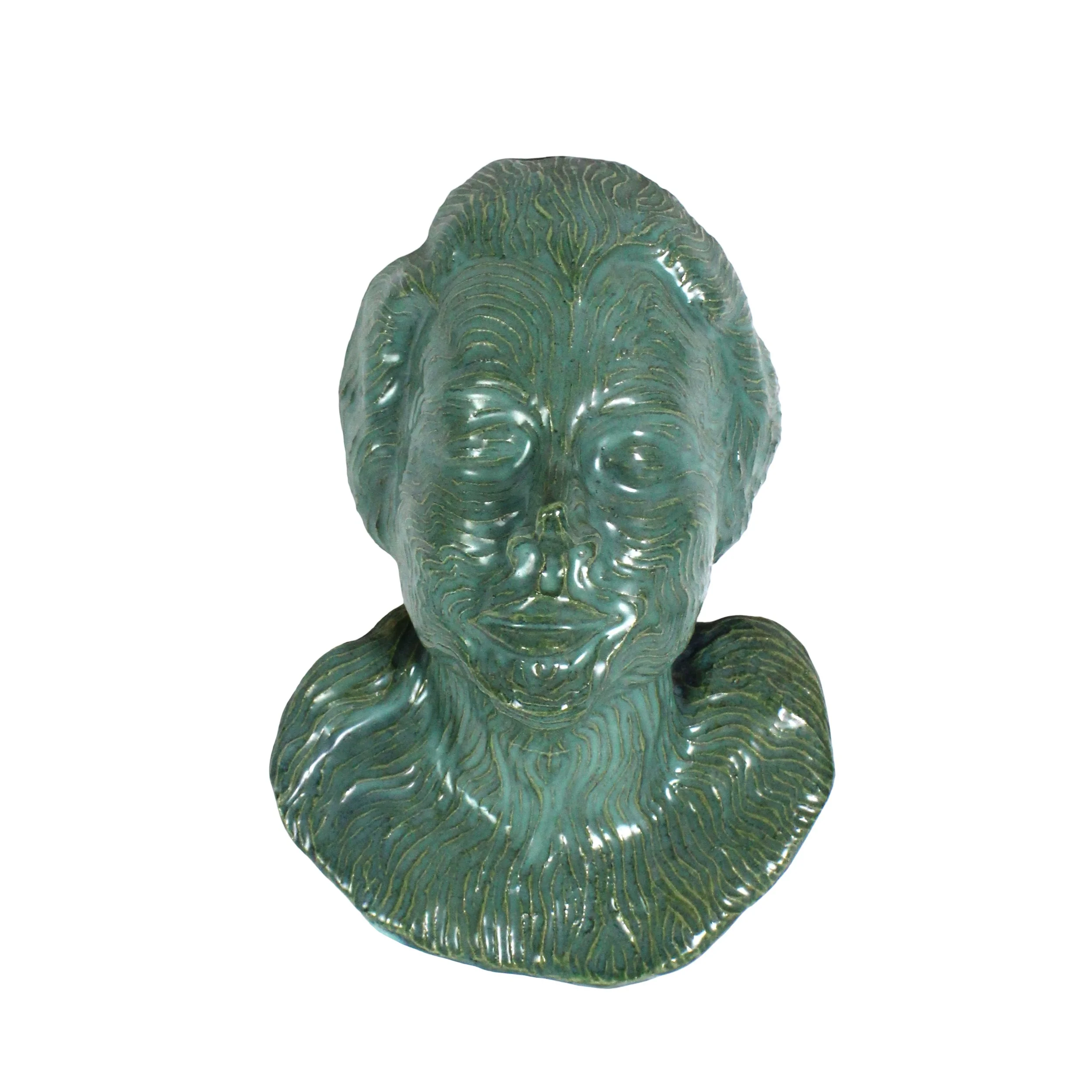 Green wavy textured pottery sculpture of a young woman's head neck and shoulders