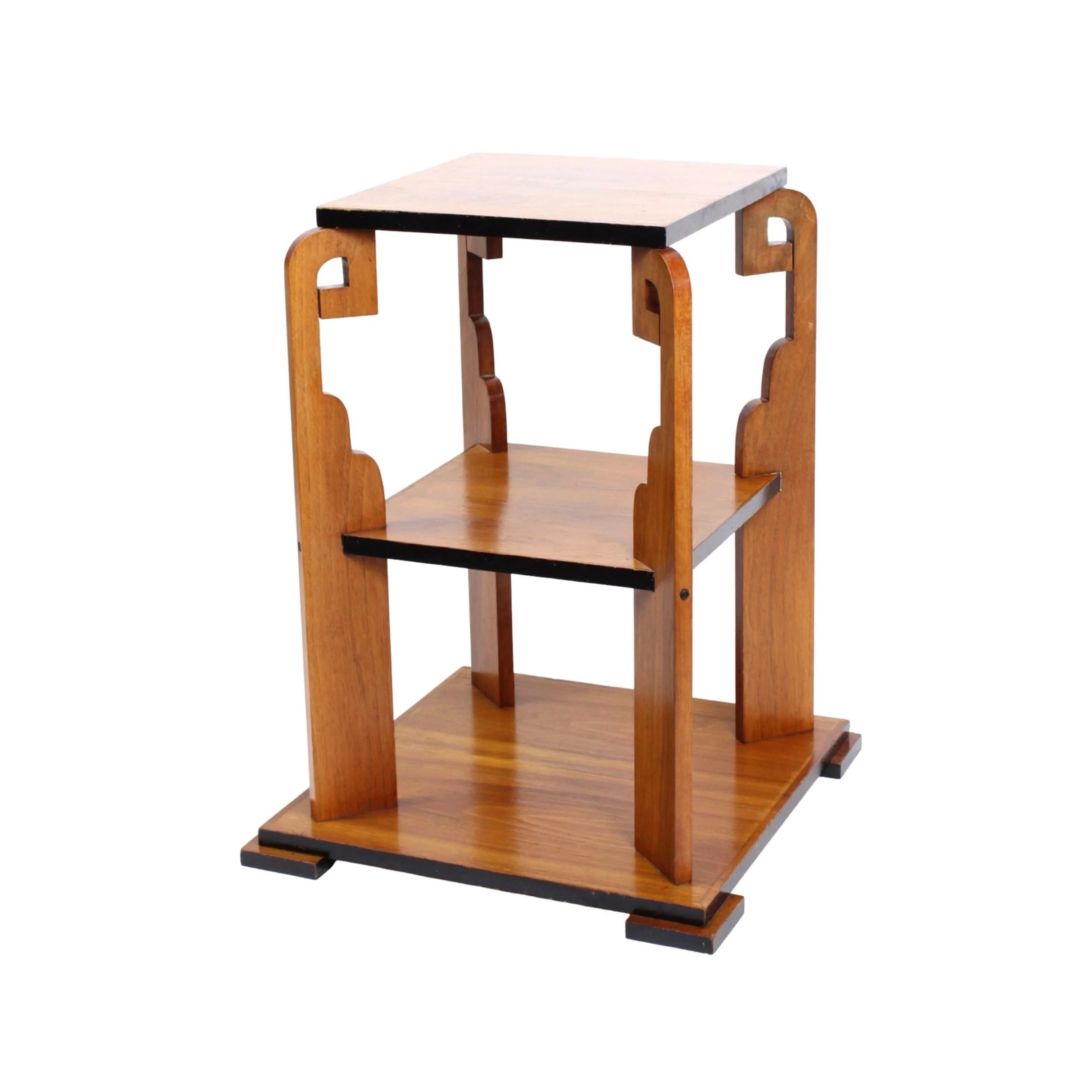 Shelf A square shaped dark wood end table with a lower shelf. The shelf and table top rest on four ornamental, geometric posts. The edges of the wood shelves are painted black.