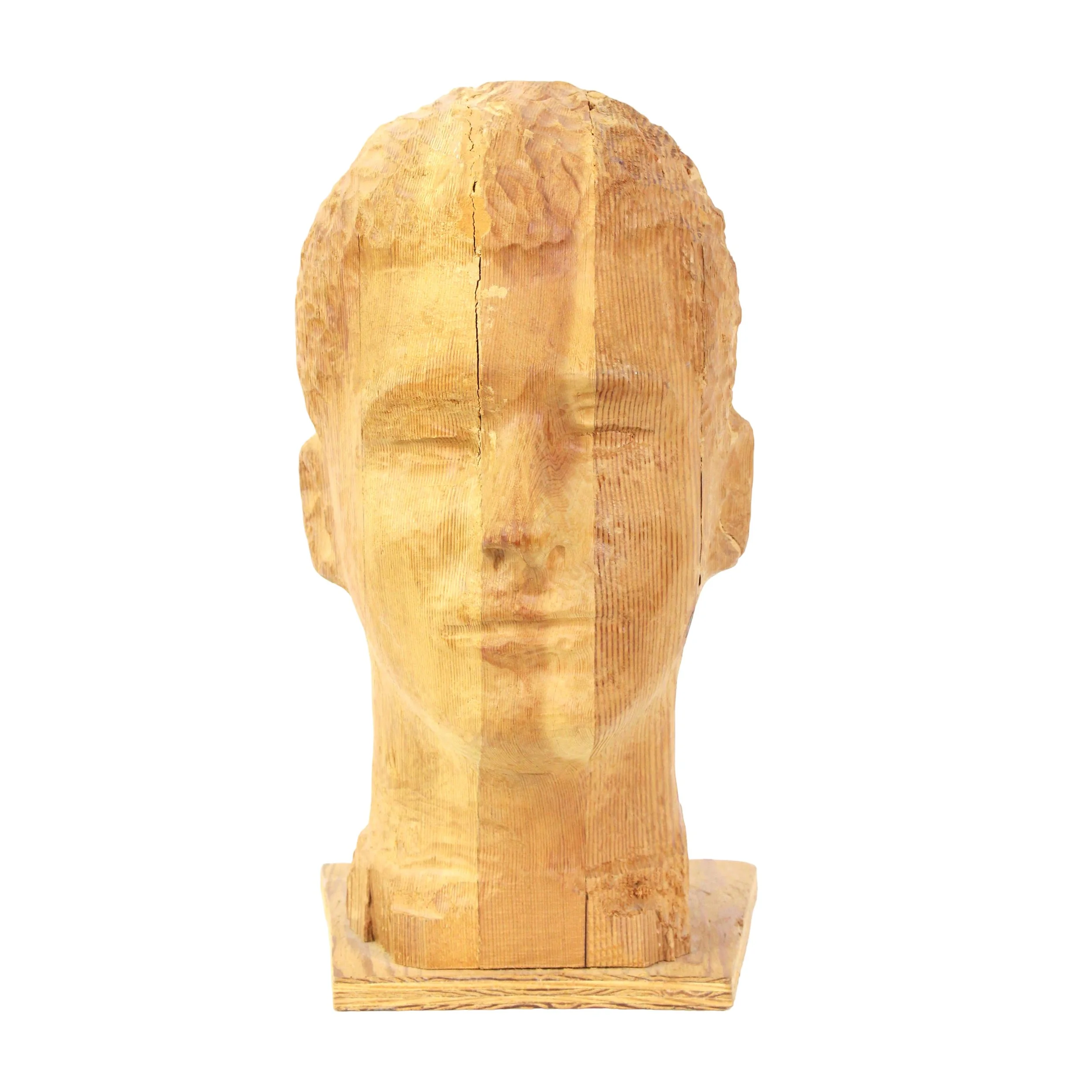 Carved wood young man's head with varying stripes of medium and light vertical stripes