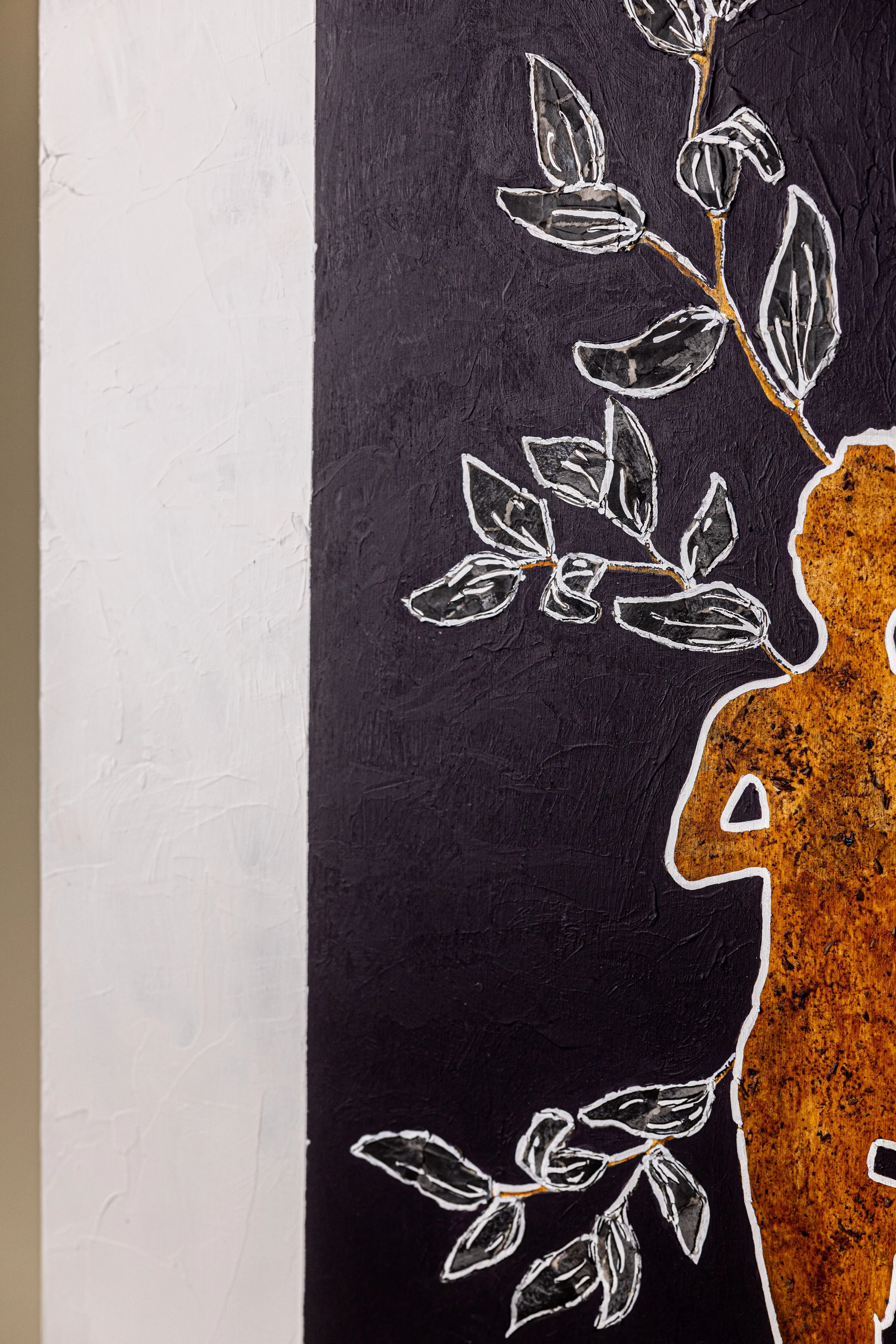 Abstract artwork featuring a silhouette and botanical elements on a textured background.
