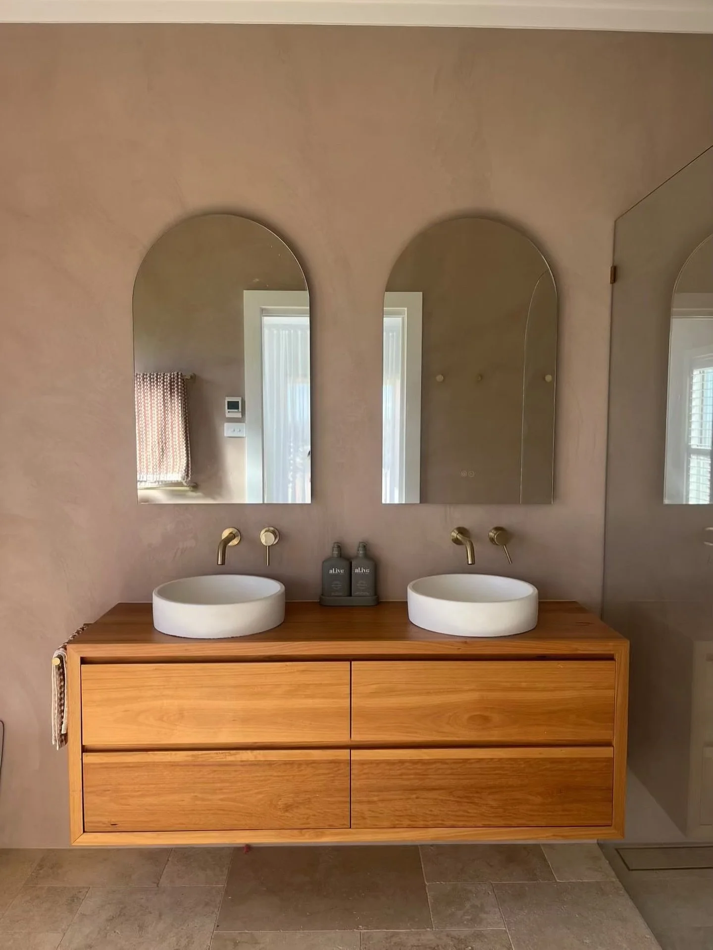 Round. Raw. Refined.

Our above counter concrete basins sit perfectly on warm timber, with micro cement walls by @mecca_wall_finishes wrapping the space in texture.

Gosh I love bathrooms!

#ConcreteBasin
#BathroomDesign
#TimberVanity
#MicroCement
#I