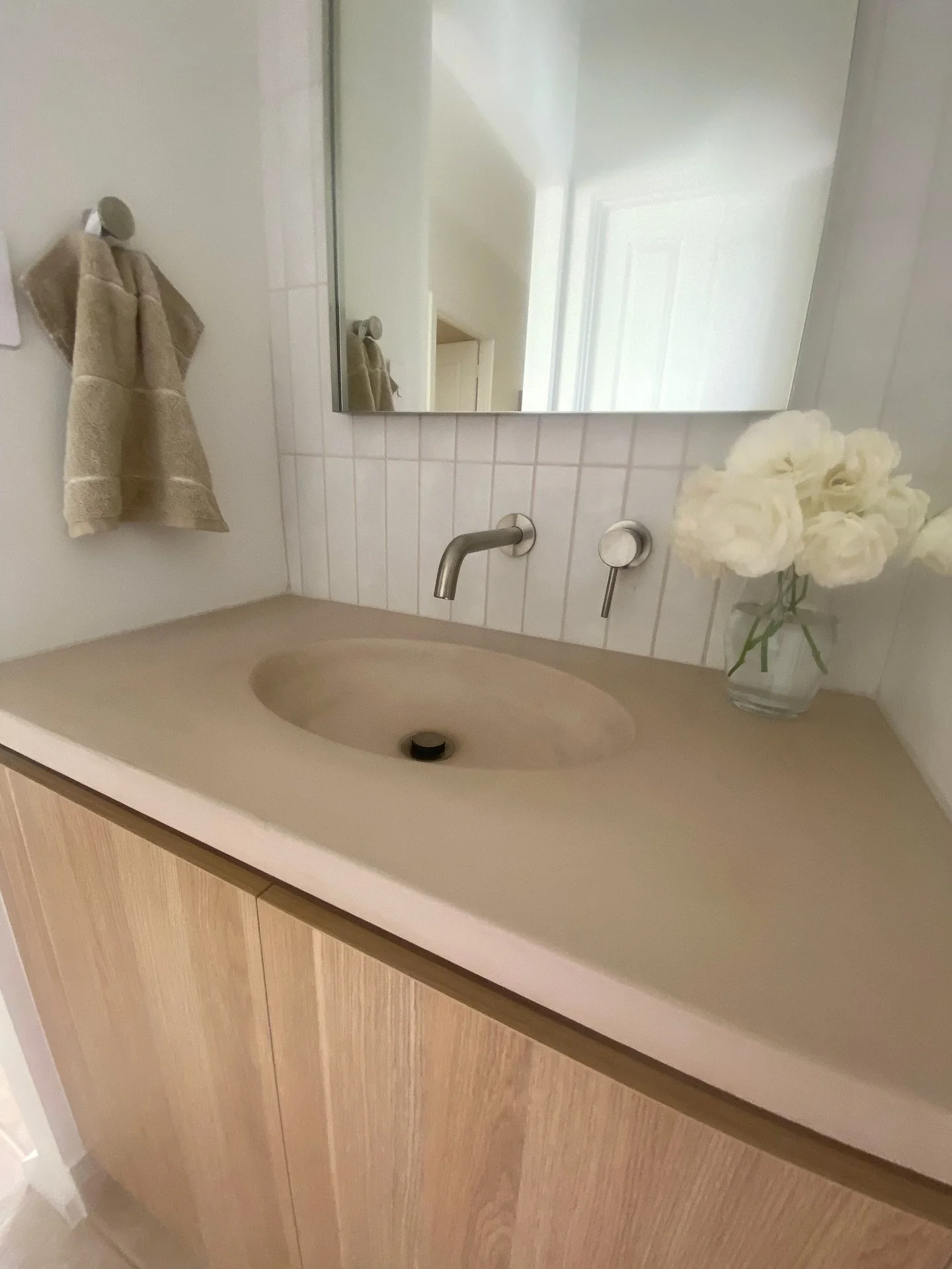 When we get sent through photos of a completed bathroom, I always do two things. 

1) Swoon 
2) Say the first three words that come to mind, when I first looked at these photos, the words were neutral, calm, and warmth. 

This bathroom features a con