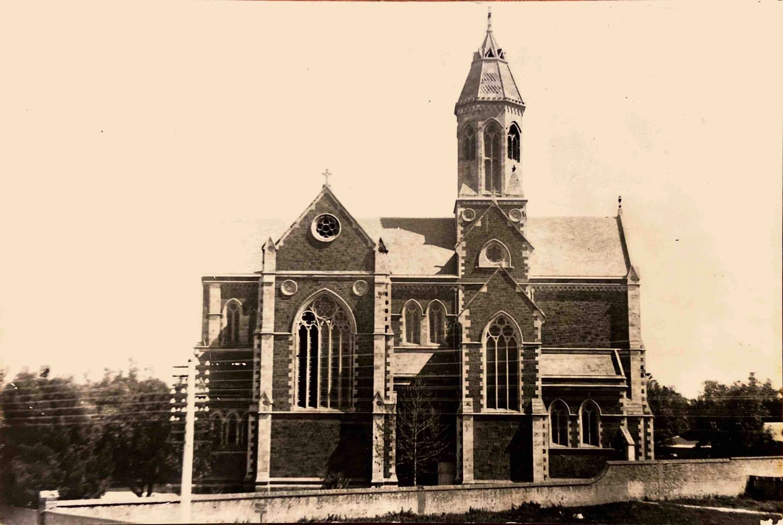 3. Northern Elevation of the Cathedral 1876-1890 - The consecration of the first stage took place on the 1st of January, 1878. This photograph was taken from the other side of King William Road. The plane tree in the current car park is quite young i