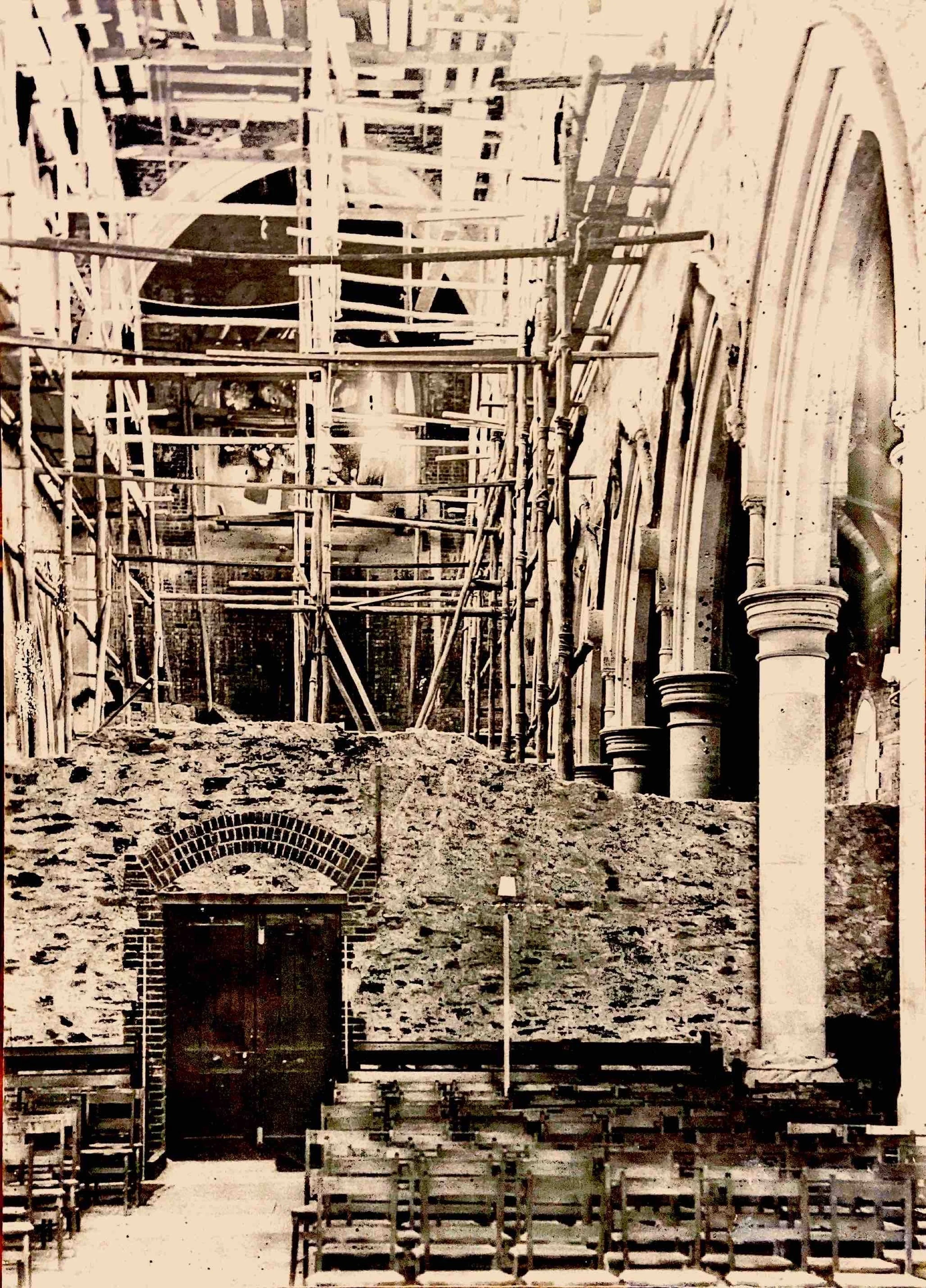6. The Interior of the Nave circa 1899 - This photo was taken looking towards the current main doors during the extension. The rose window is in place. The new interior walls were built of brick which was then plastered over. The dividing wall was re