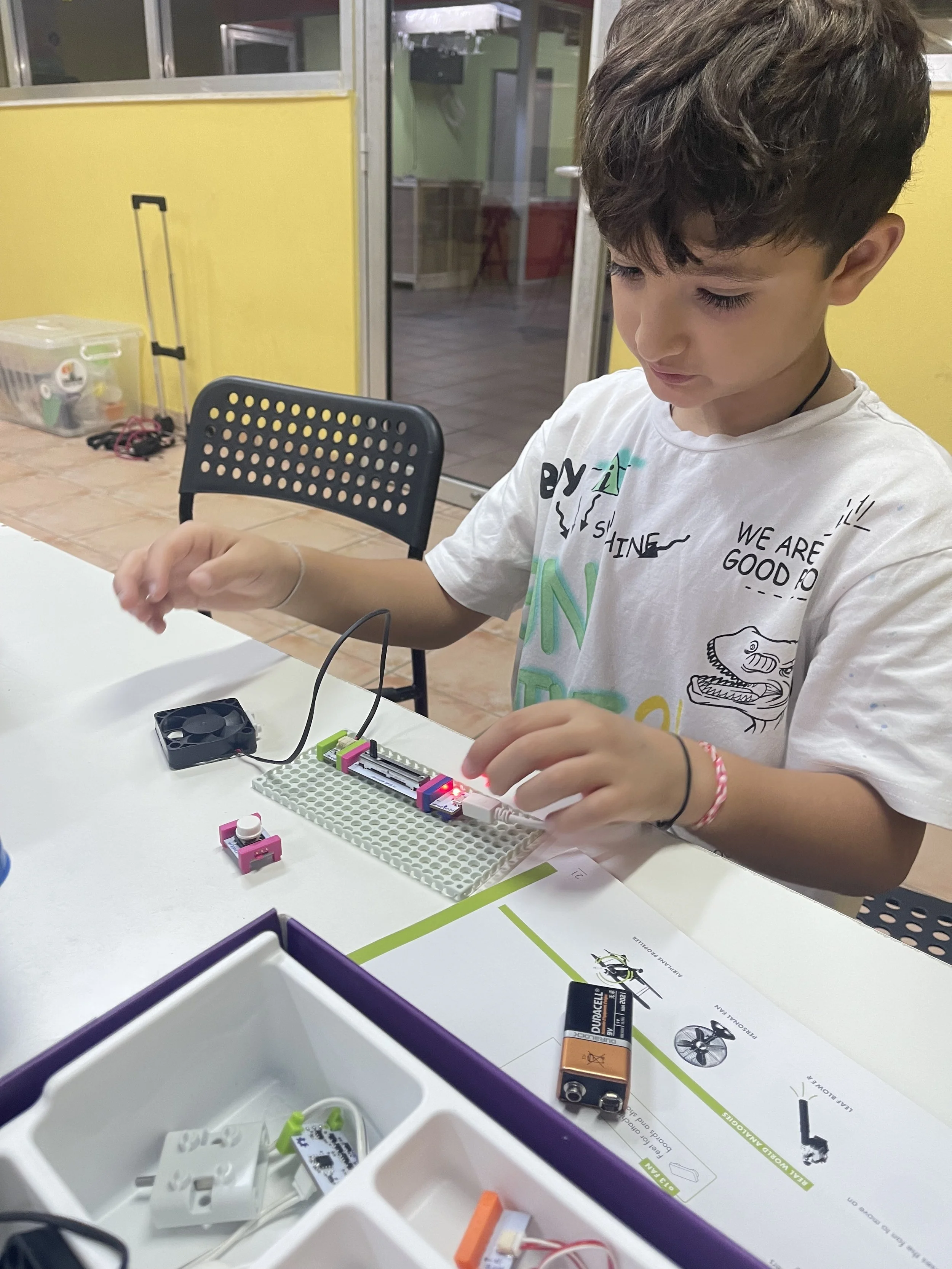 Child building a circuit project at Cranium