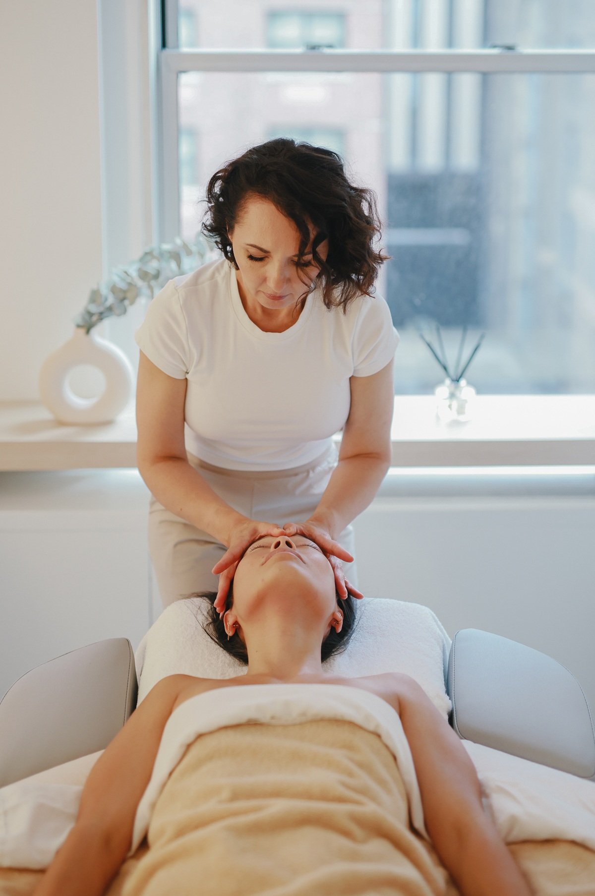 Valerie Terletskiy performing a hands-on facial treatment at SENSO Skin Experts in New York.
