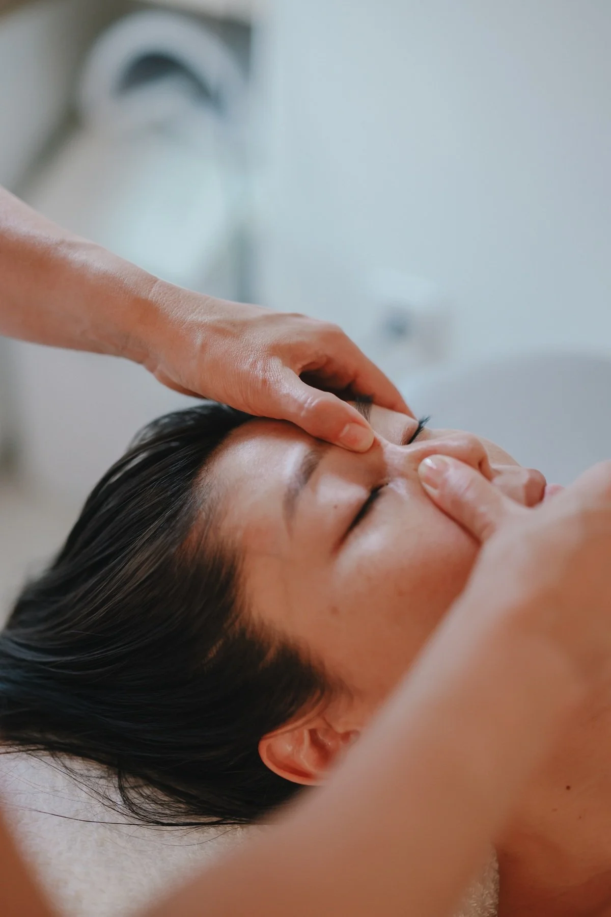 Close-up of a woman's face, jawline and neck, representing facial sculpting treatments at SENSO in New York City.