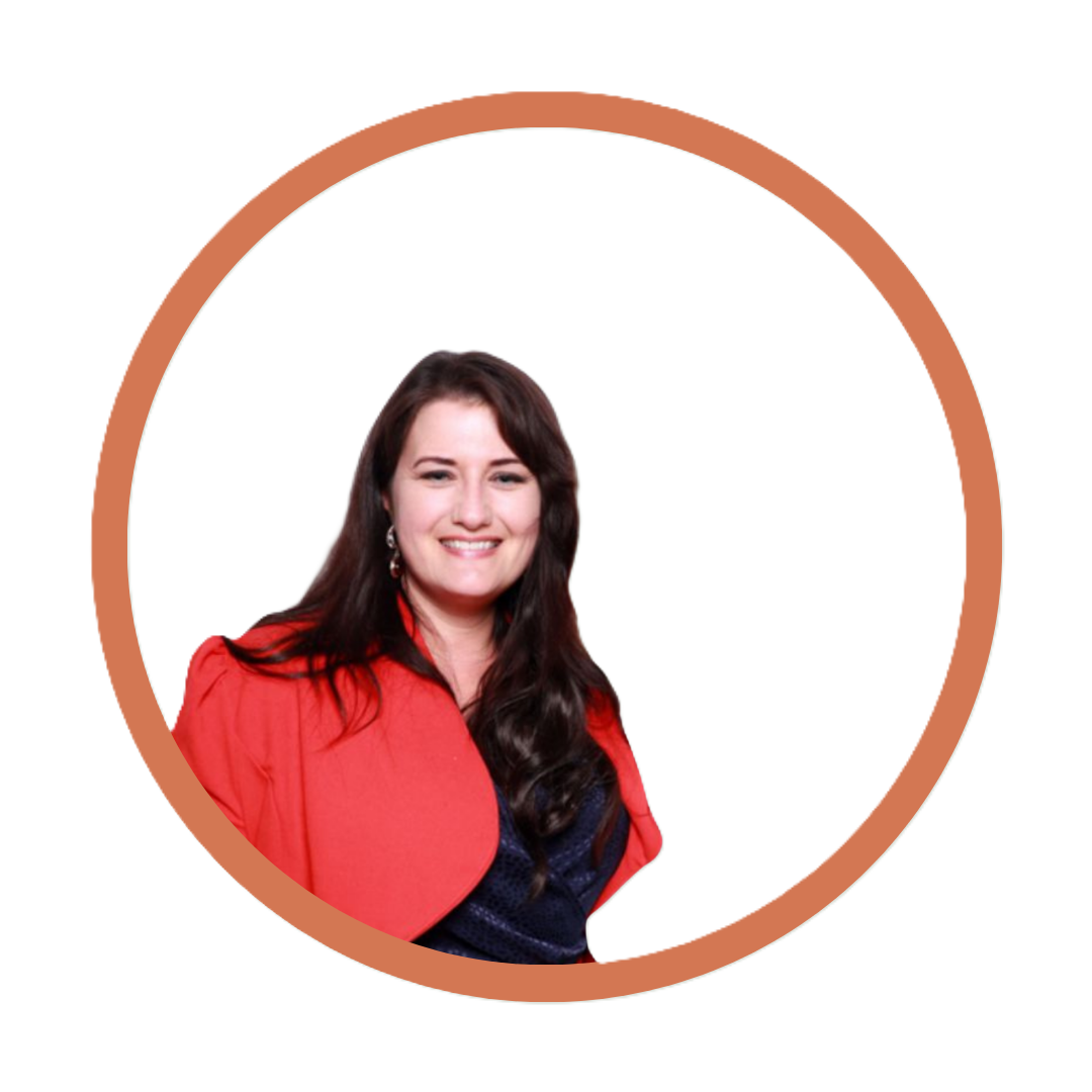 A woman with long dark hair smiling, wearing a red blazer over a dark top, appears in a circular frame with a light background and a brown border.