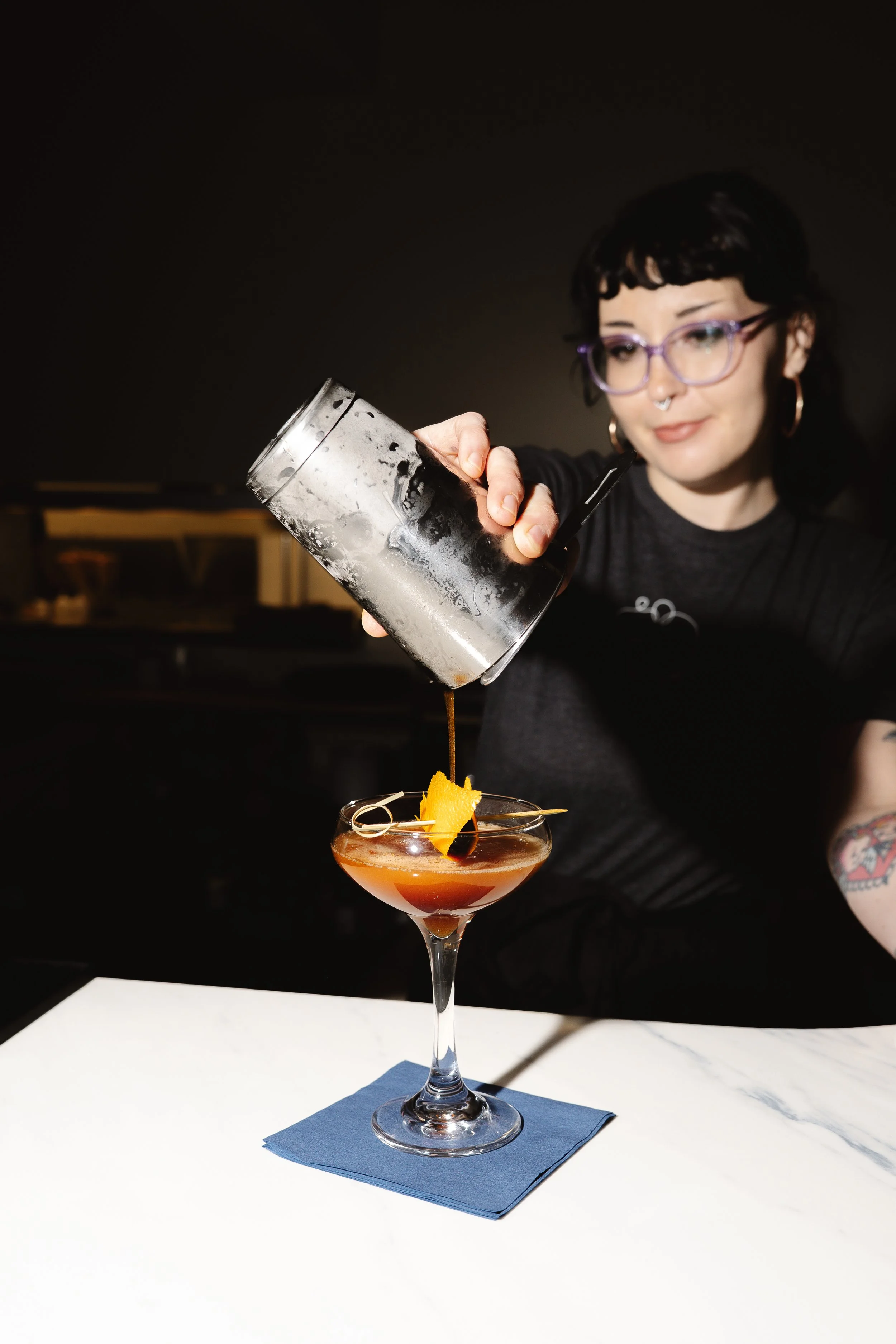 Photo of a bartender pouring a cocktail at Topolino restaurant in Dover, New Hampshire, taken by seacoast restaurant and food photographer Katherine Keenan.