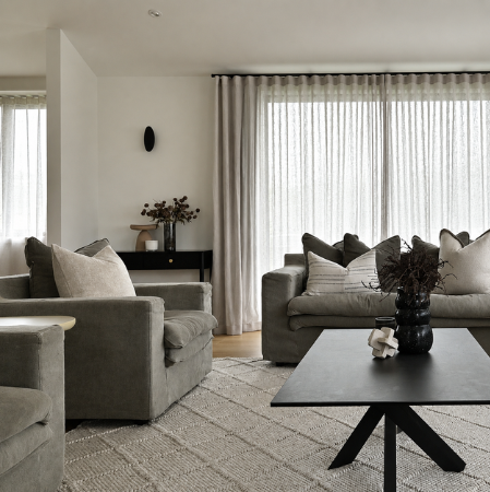 modern living room with homely comfortable furniture and shear curtains