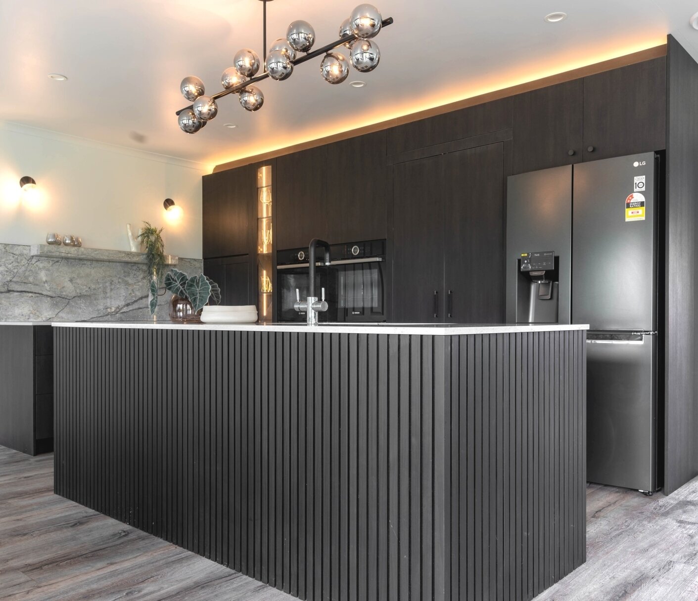 ✨ Kitchen Reveal! ✨

Step into a world where moody elegance meets modern sophistication. This warm black kitchen creates a subtle yet luxurious ambiance that's simply perfect for entertaining.

✨ Features: hidden pantry,  Ceasarstone benchtop, elegan