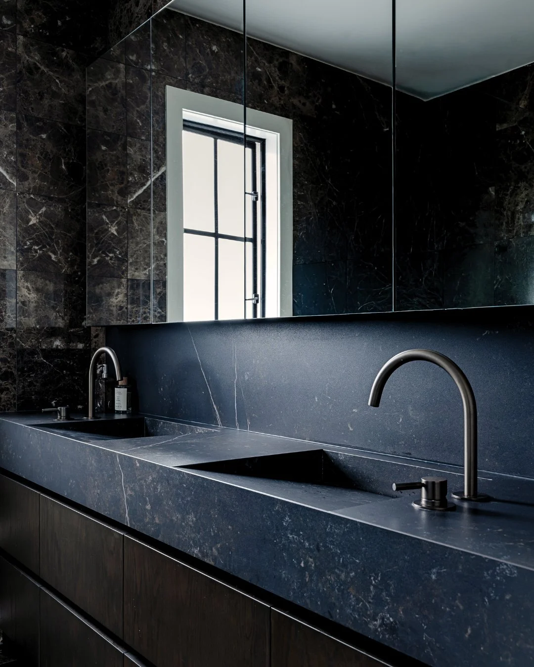 More from our Saint Heliers renovation.

This ensuite already had beautiful natural stone tiles, so rather than starting again, we kept the original bathroom intact and focused on elevating the vanity wall. Sometimes the smartest design move is knowi