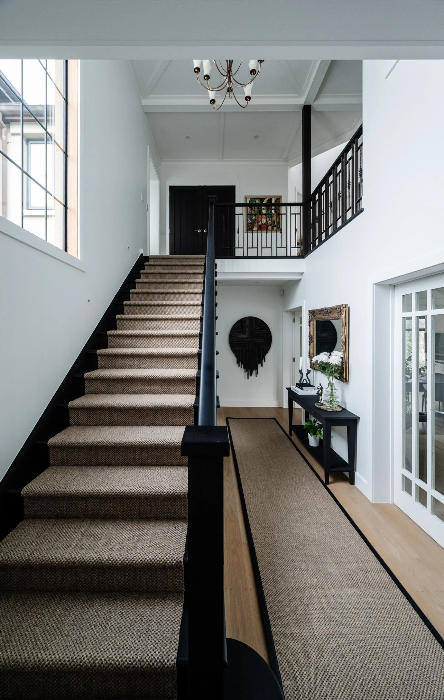 We took this staircase from classic to contemporary. A dark stain on the timber and a fresh sisal runner brought in modern contrast and natural texture. Proof that details make all the difference!