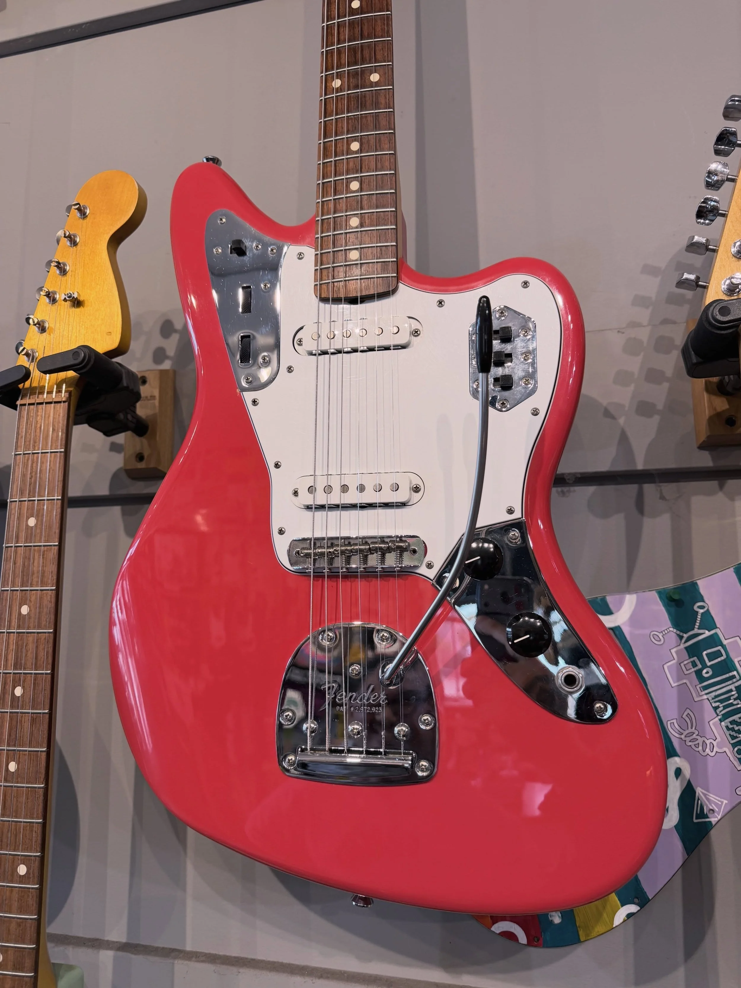 A super cool lacquer finish Fender Jaguar in Fiesta Red hittin the wall!! Come play!!