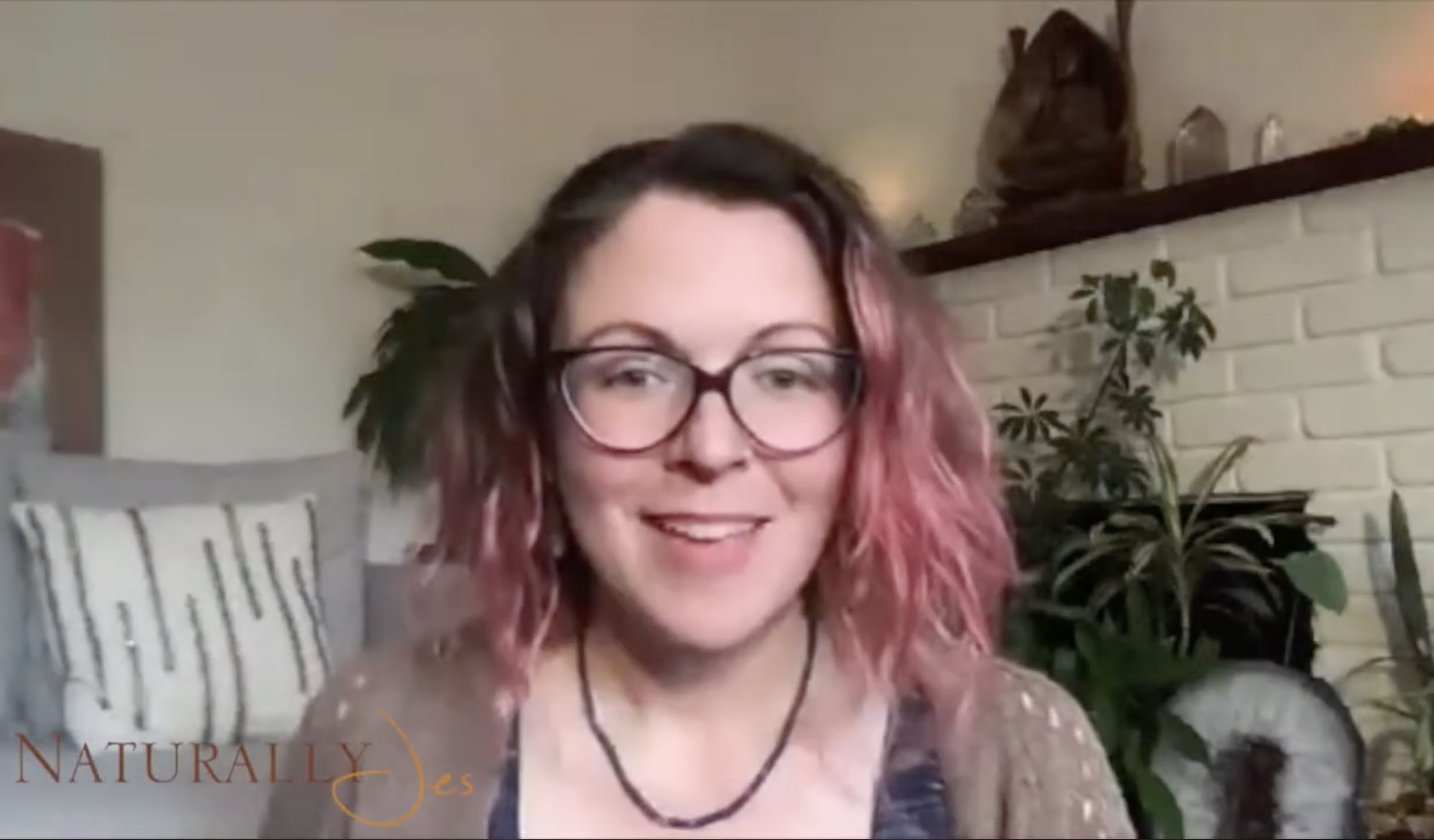 A photo of Jes on YouTube, talking about what she loves about acupuncture and healing!