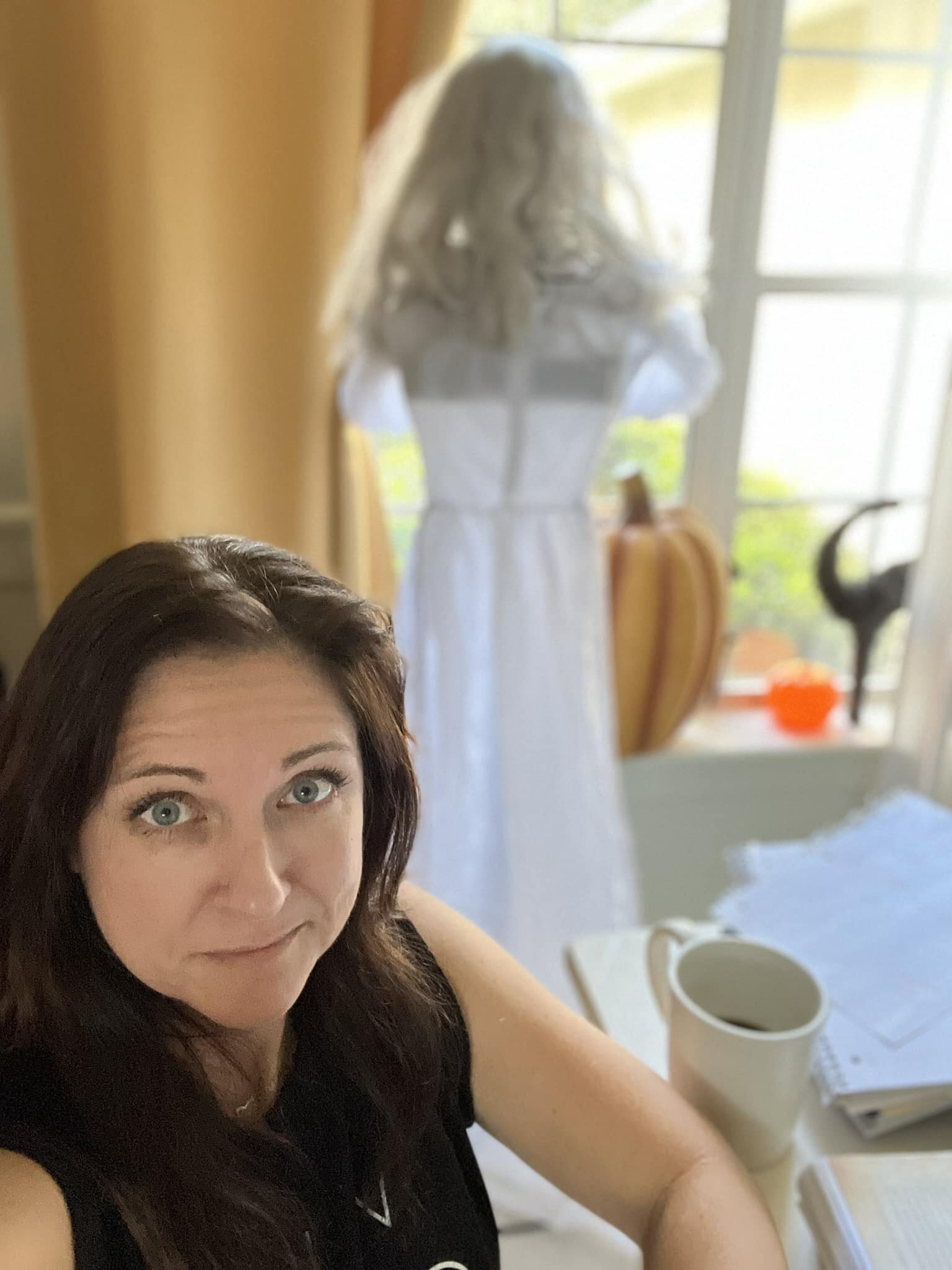 She scared me all last year too. At least she&rsquo;s not in the kitchen&rsquo;s breakfast area this year...I had several small heart attacks last year walking in to see her. 

Today she&rsquo;s peeking out curtains. I do wonder what neighbors think.