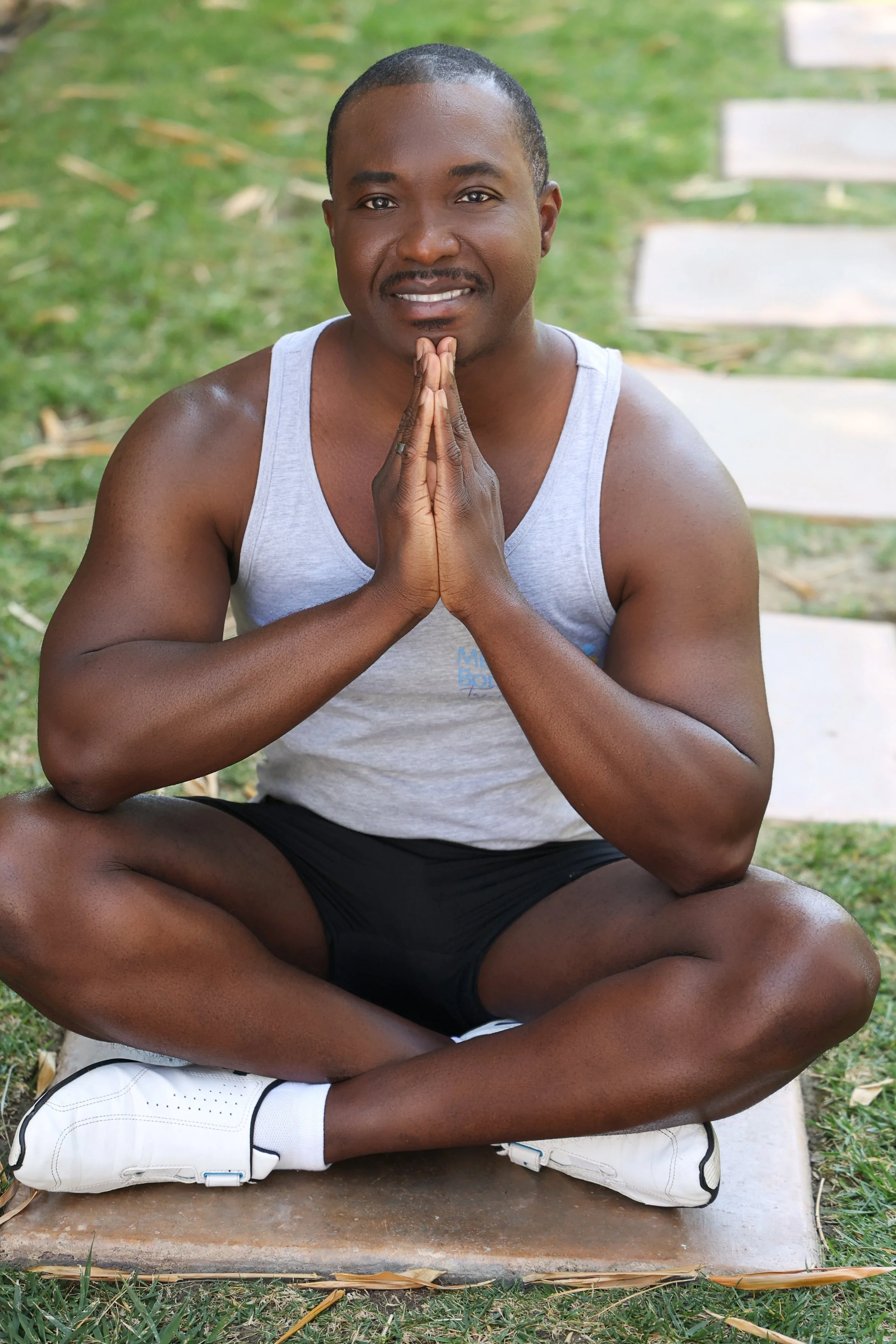 Trevor James standing with a group of men, all showing support and unity, representing connection and personal growth.