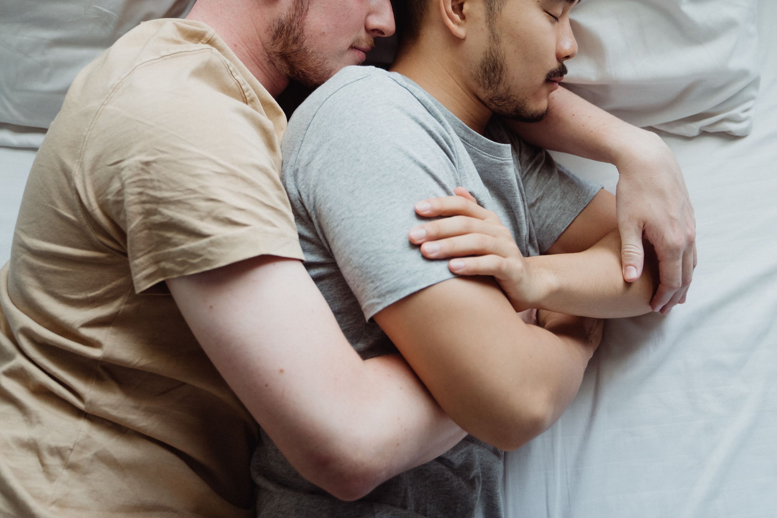 Individuals participating in a professional cuddle therapy session