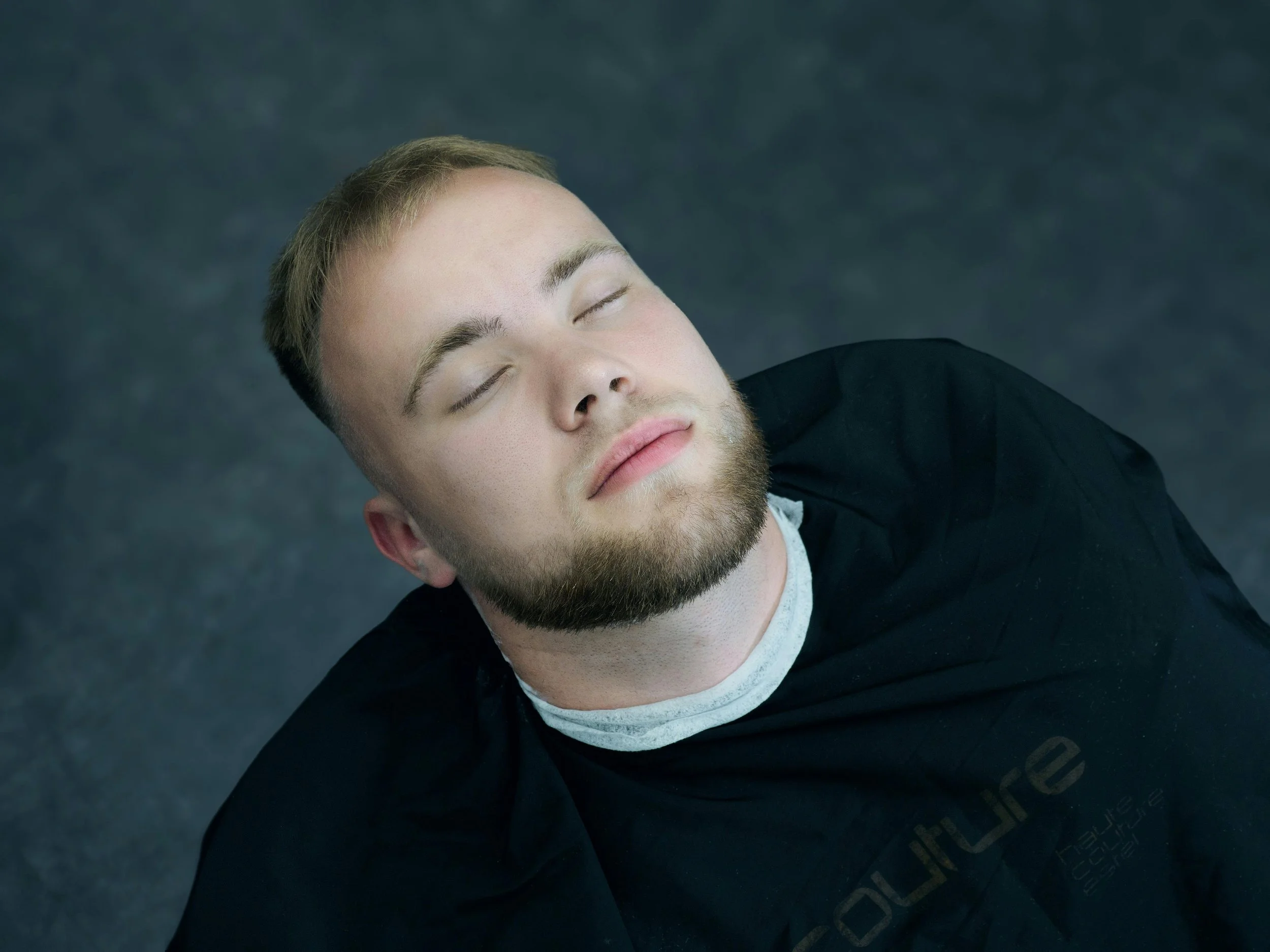 Person with eyes closed in a calm, reflective moment
