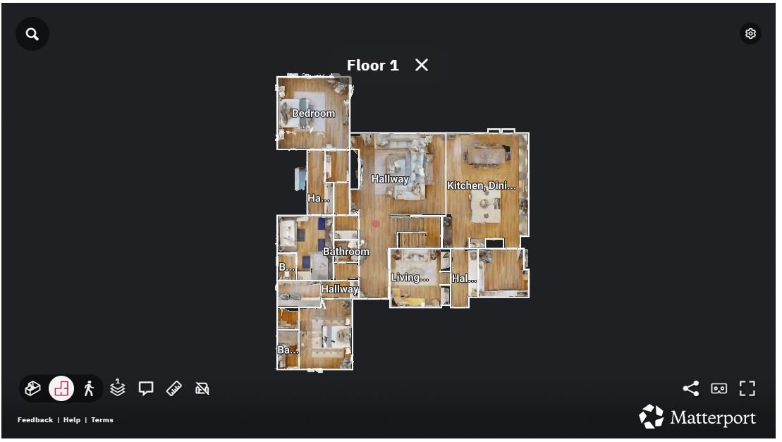 A digital floor plan of a house showing various rooms: bedroom, hallway, bathroom, living room, kitchen, dining area, and other connecting spaces.