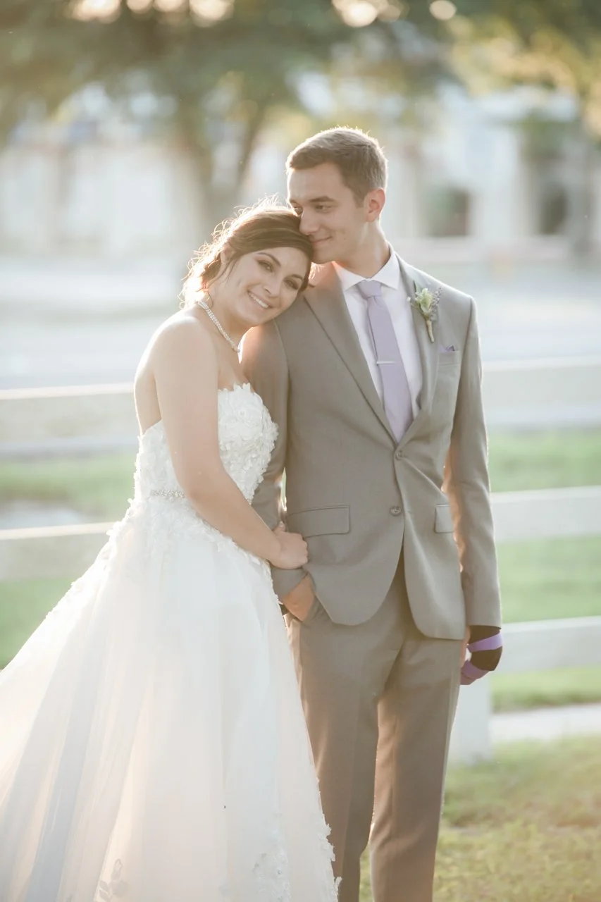 Laurie’s customers, Fernando and Kate embracing by the lake on their wedding day.