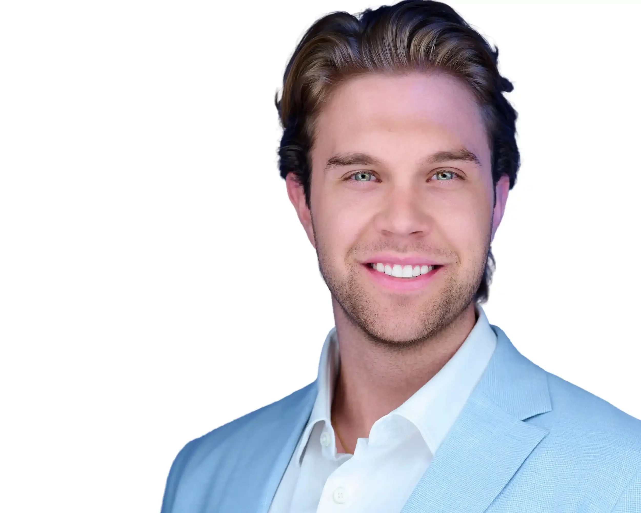 Portrait of a young man with brown hair and blue eyes, smiling, wearing a light blue blazer and a white shirt, against a white background.