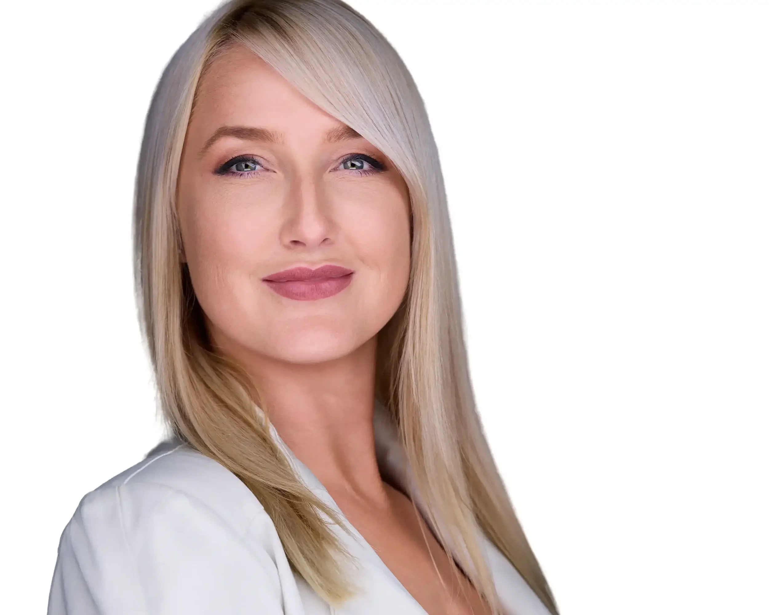 Close-up of a blonde woman with blue eyes smiling slightly, wearing a white top, against a white background.
