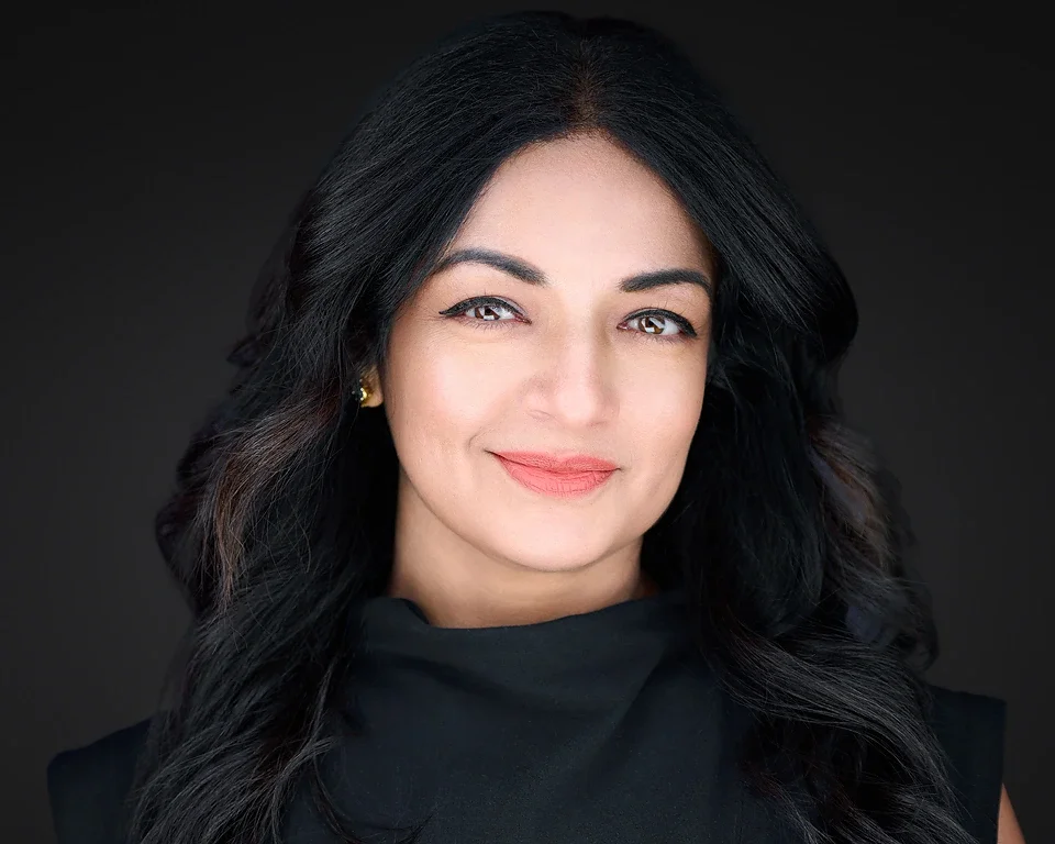 corporate professionals with polished headshots on a dark background — corporate headshot photography Las Vegas Pandorica Headshot Studio