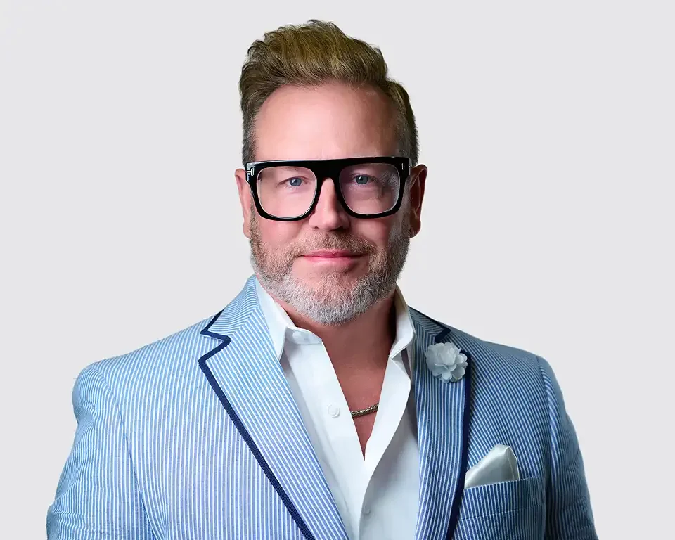 Professional headshot of a man in a light blue suit by Pandorica Headshot Studio Las Vegas
