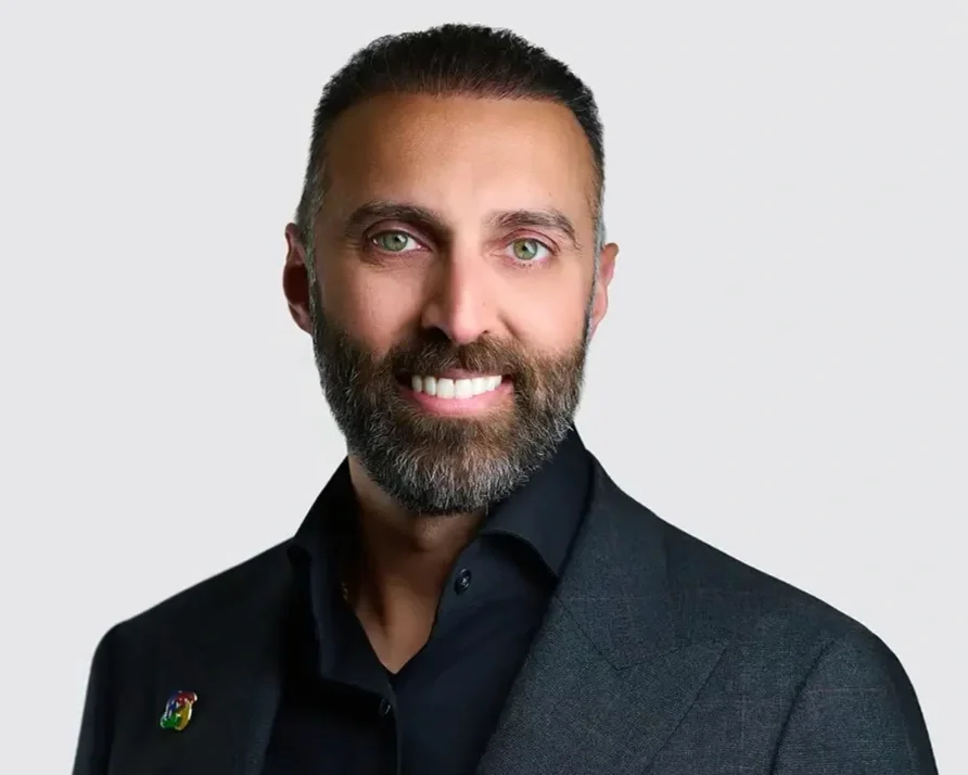 Professional headshot of a man with a dark beard wearing a dark jacket, photographed at Resorts World Las Vegas during ThriveLIVE 2026 by Pandorica Headshot Studio