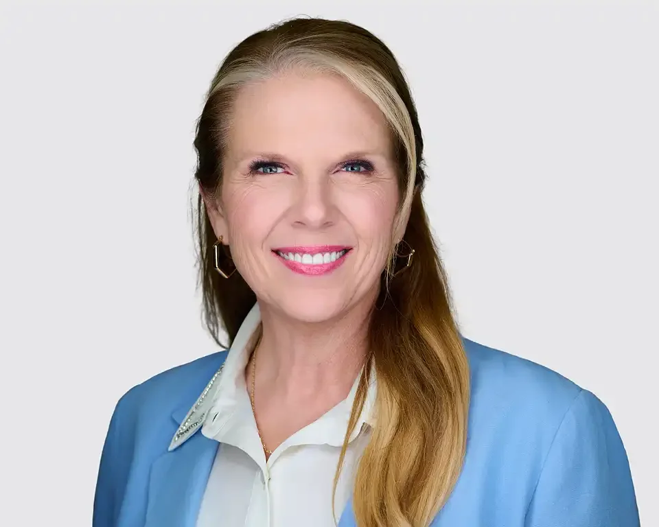 Professional headshot of a woman with blonde hair wearing a blue blazer, photographed at Resorts World Las Vegas during ThriveLIVE 2026 by Pandorica Headshot Studio