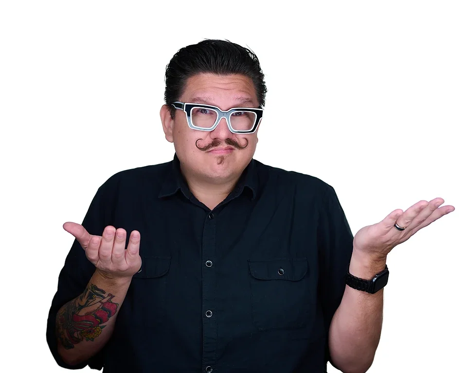 Mondo rojas shrugging shoulders in a black shirt on white background-las vegas branding image pandorica headshot studio