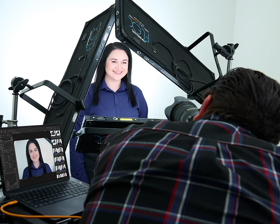 Client reviewing headshot images on monitor during session at Pandorica Headshot Studio Las Vegas