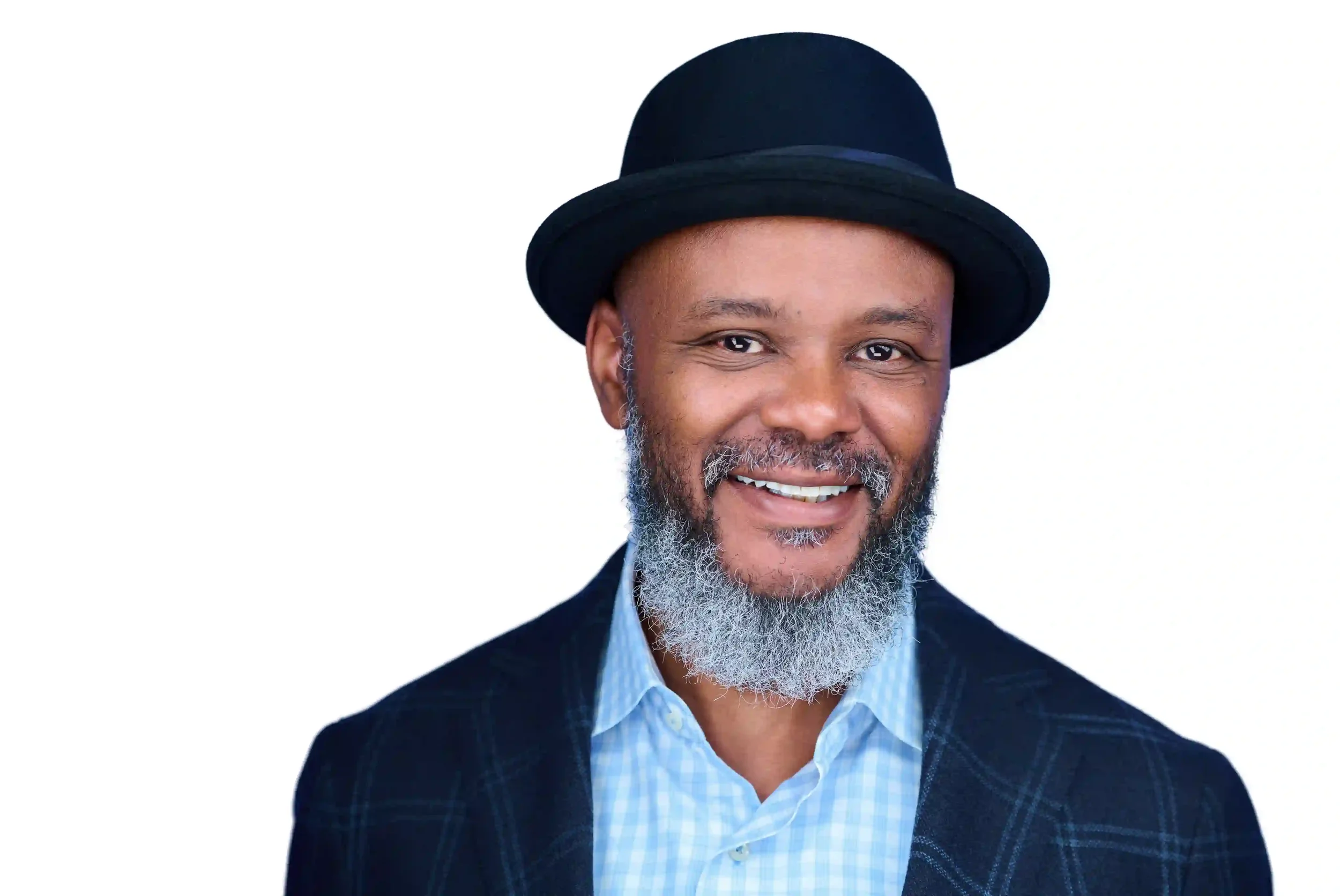 Smiling African American man in a black fedora, checkered blazer, and light blue button-up shirt against a white background.